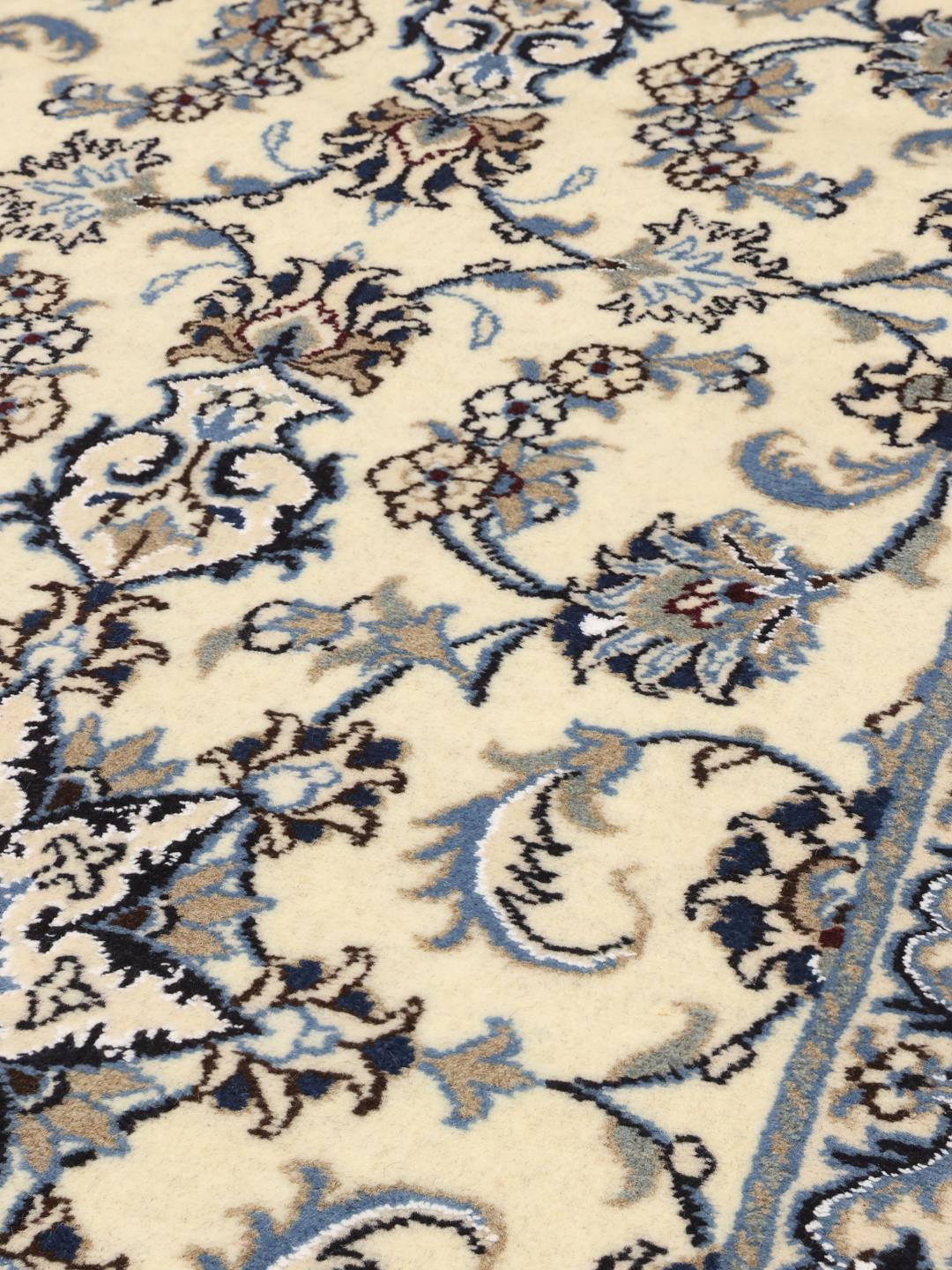 Hand-knotted Nain runner with floral patterns in beige and blue