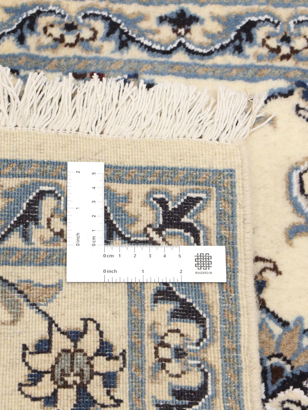 Hand-knotted Nain runner with floral patterns in beige and blue
