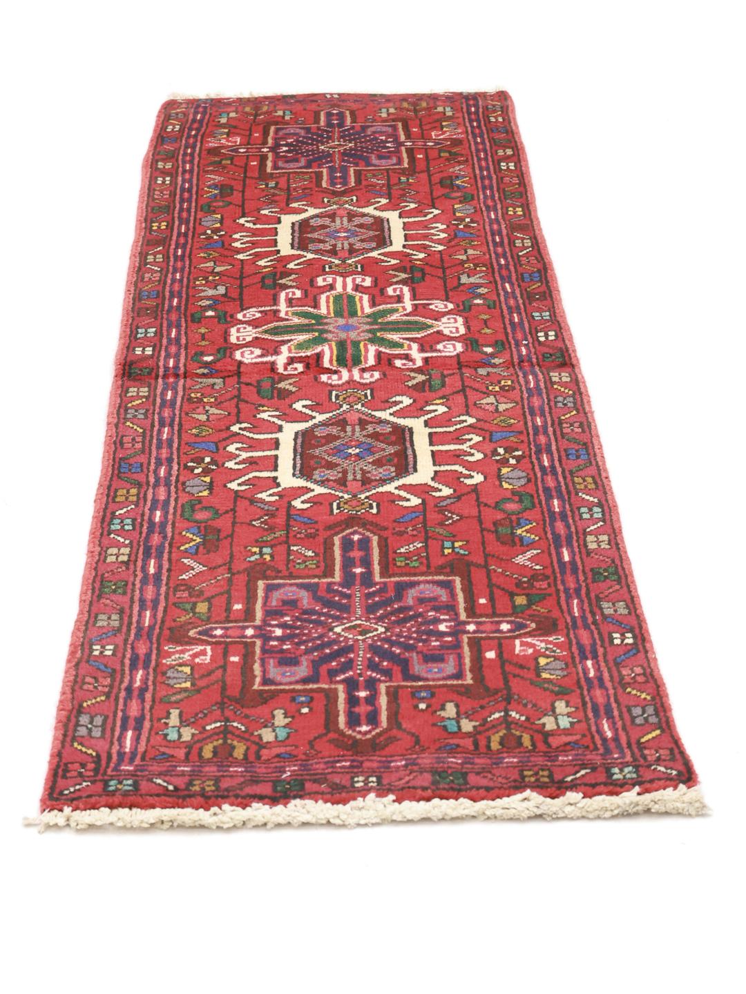 Hand-knotted Heriz runner from the Middle East in deep red tones