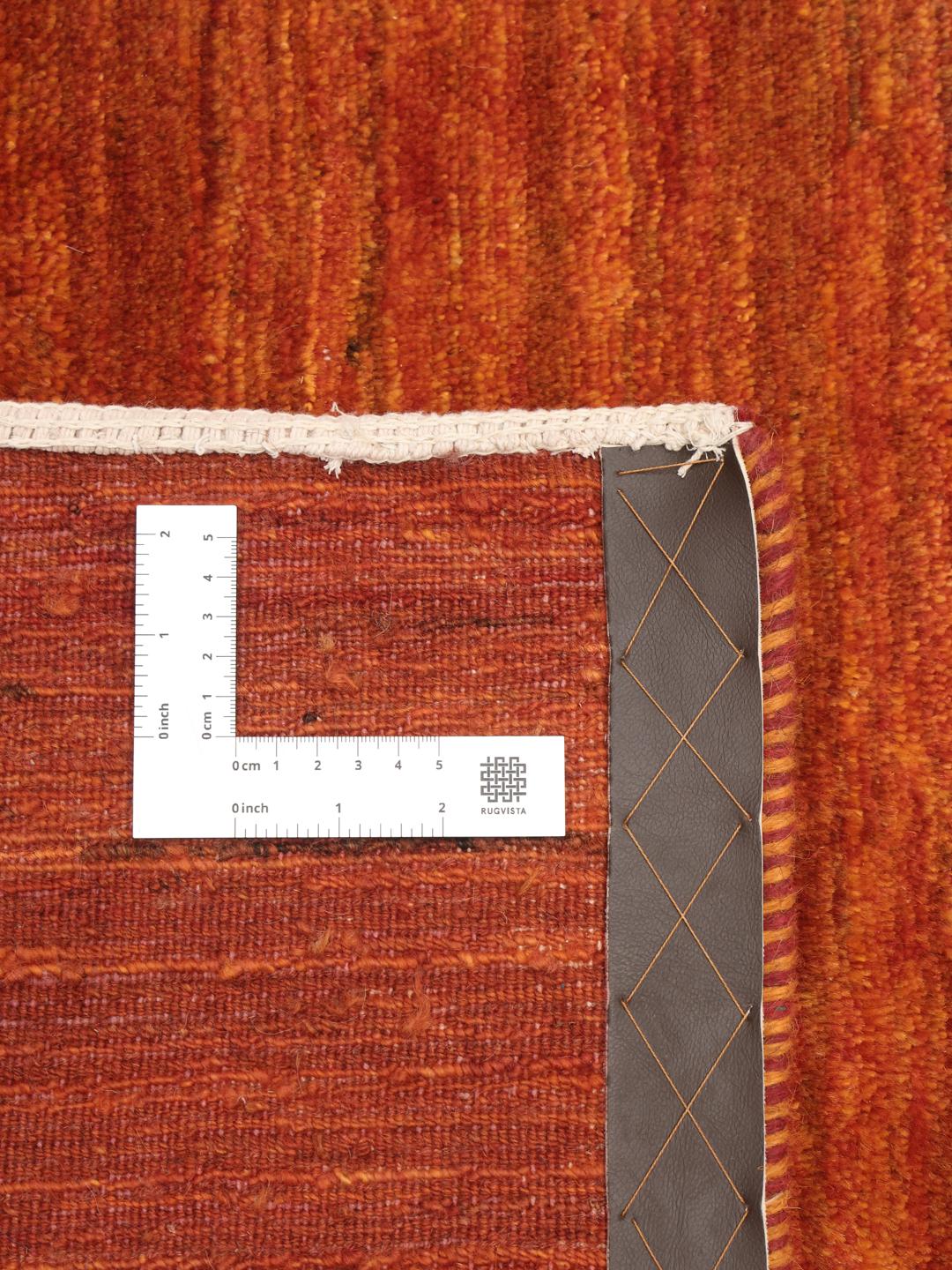 Tapis Gabbeh noué à la main originaire du Moyen-Orient dans des tons rouges