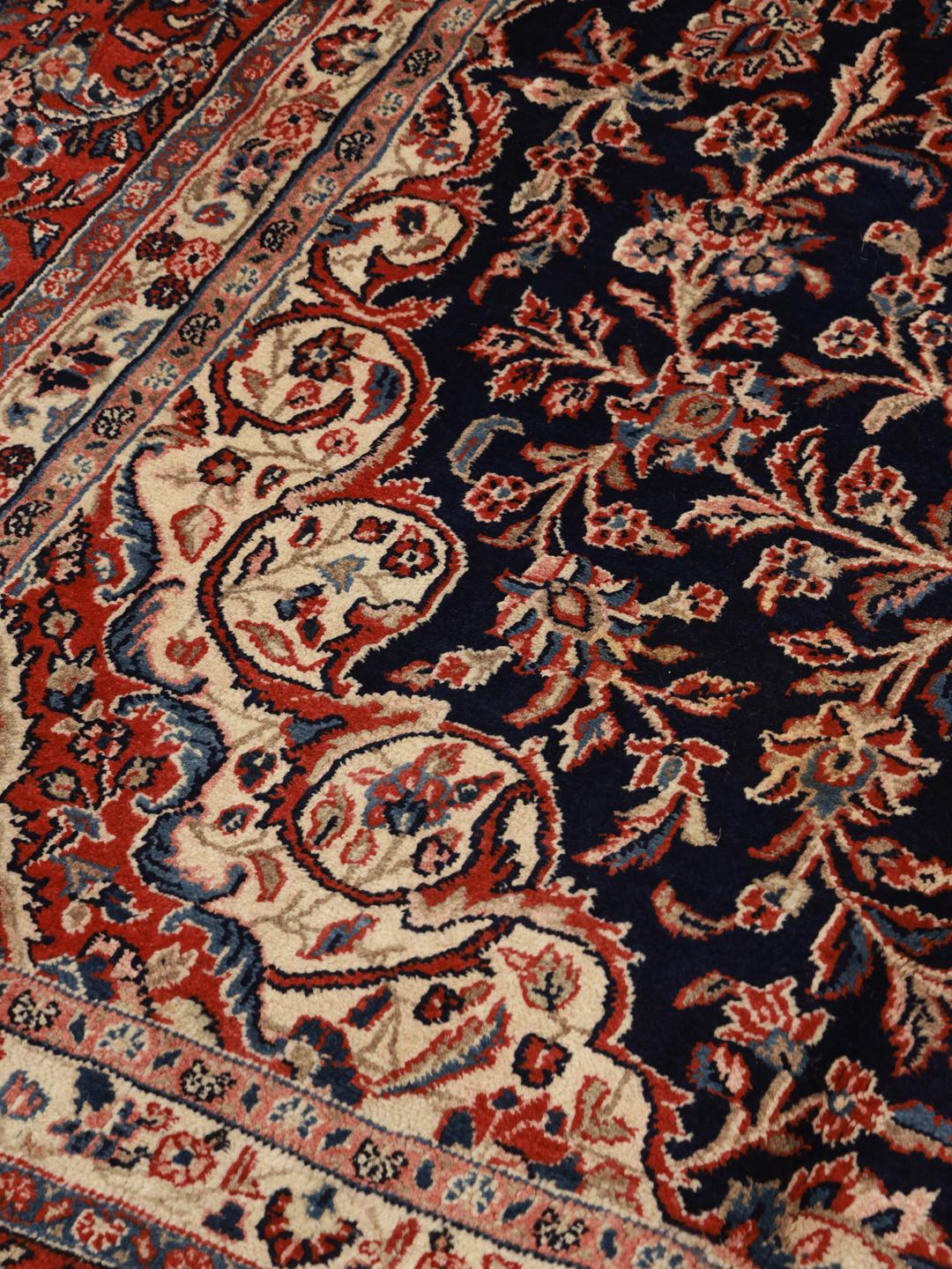 Hand-knotted Hamadan rug from the Middle East in dark-blue and red