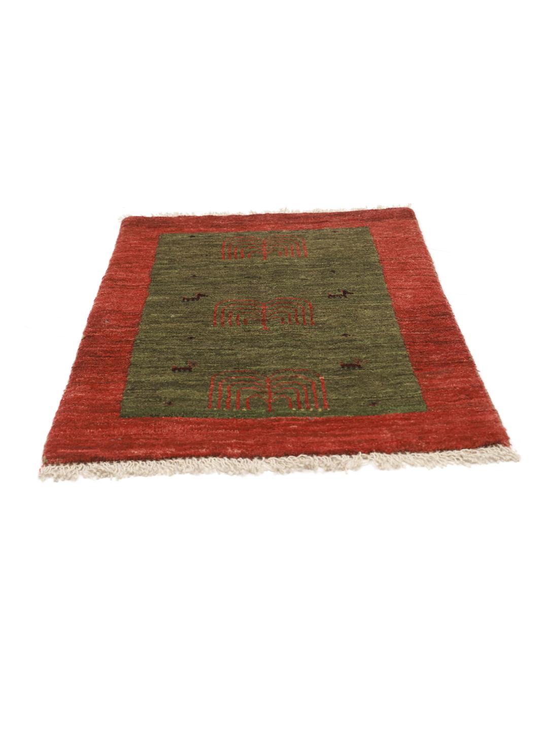 Hand-knotted Shabargan rug from the Middle East with green and red colour tones