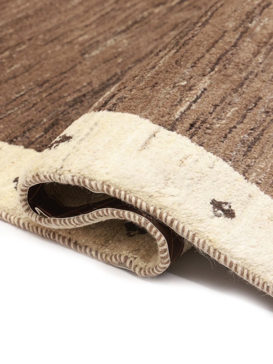 Hand-knotted Gabbeh rug with a brown field and beige border, Middle Eastern origin.