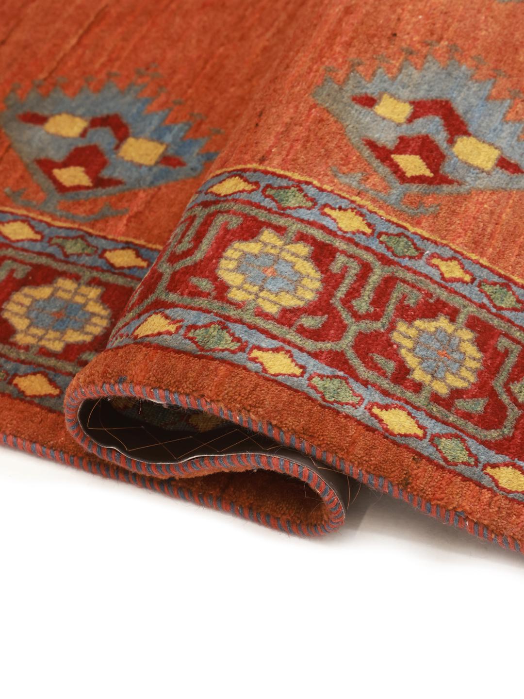 Hand-knotted Loribaft rug with a red field and geometric motifs