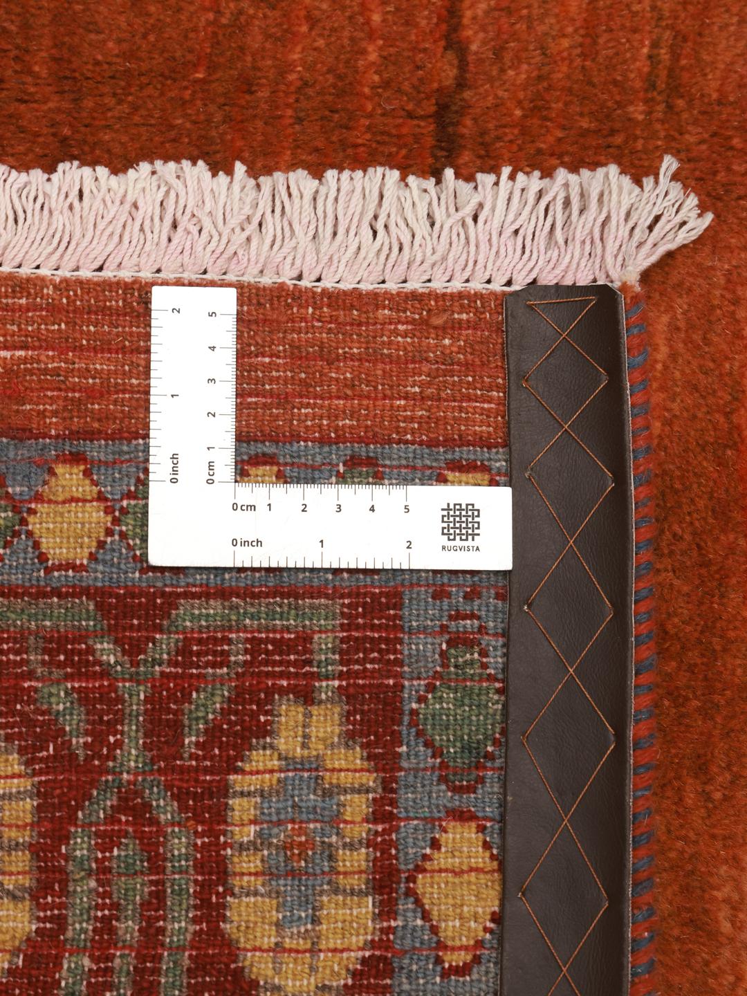 Hand-knotted Loribaft rug with a red field and geometric motifs