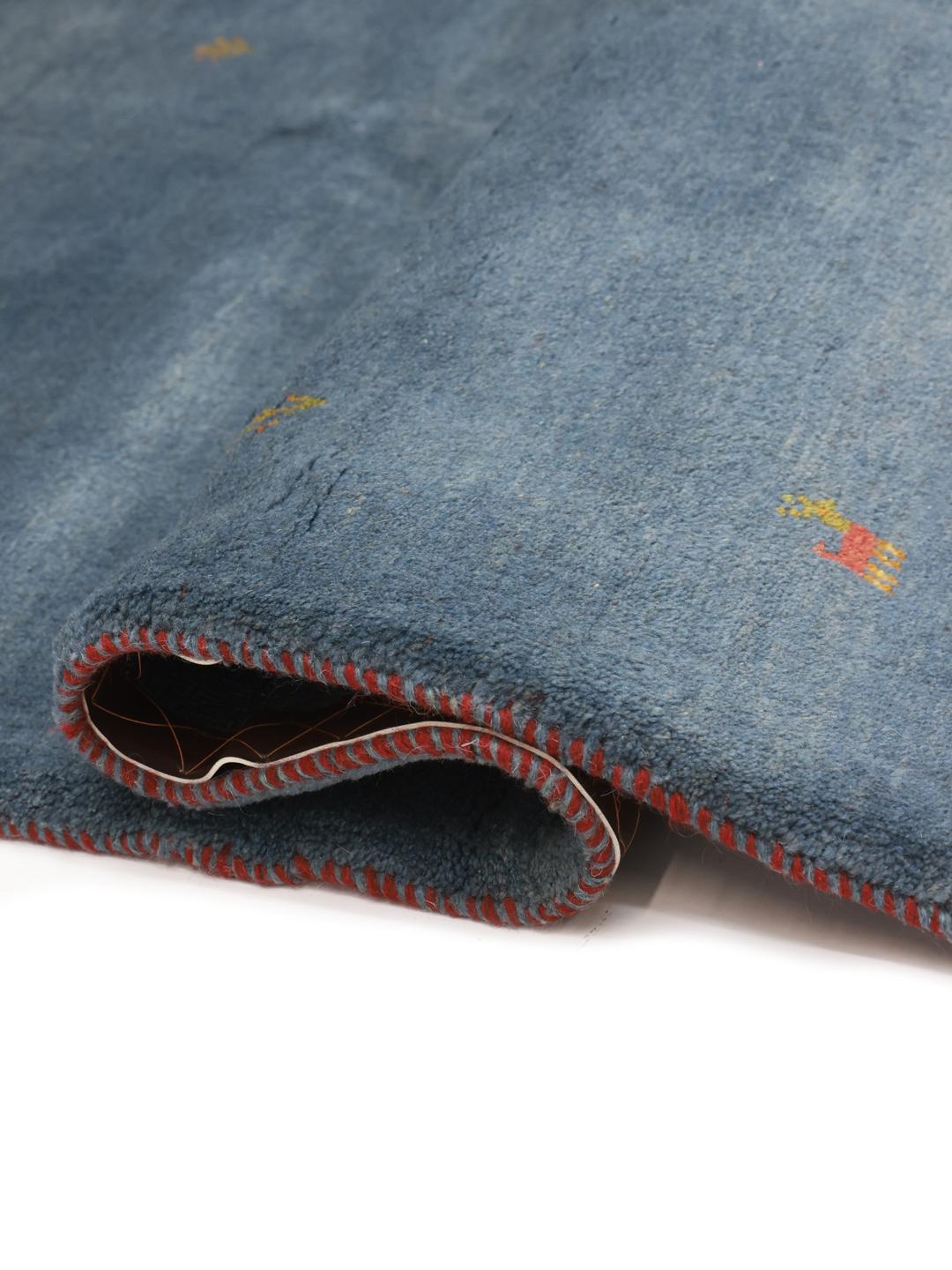 Handgeknoopt blauw Shabargan-tapijt met minimalistische motieven