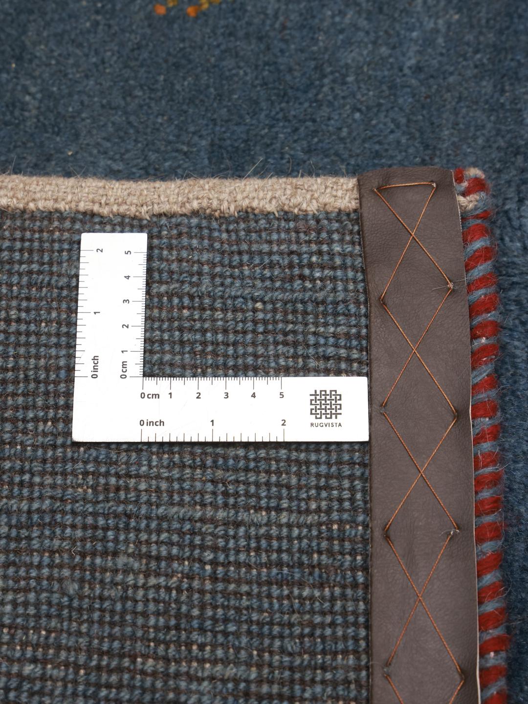 Handgeknoopt blauw Shabargan-tapijt met minimalistische motieven