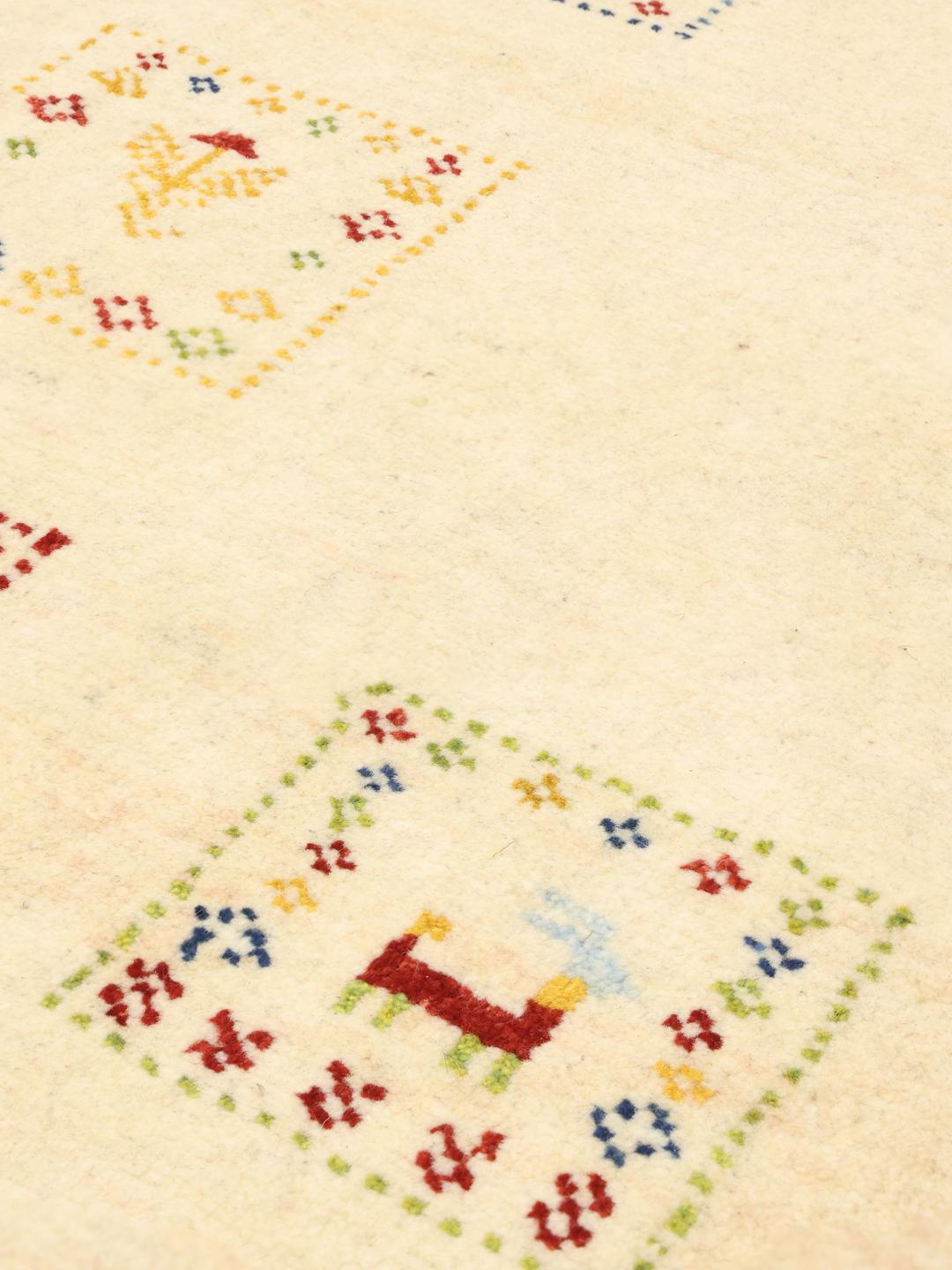 Hand knotted Gabbeh rug from the Middle East with a beige background and colourful motifs