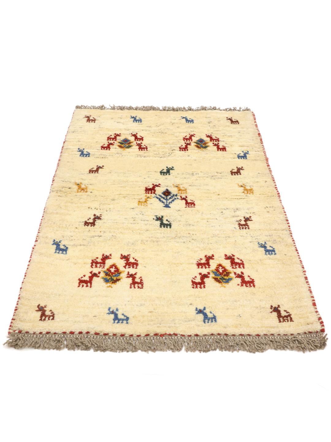 Hand-knotted Gabbeh rug with animal motifs on a cream wool field from the Middle East