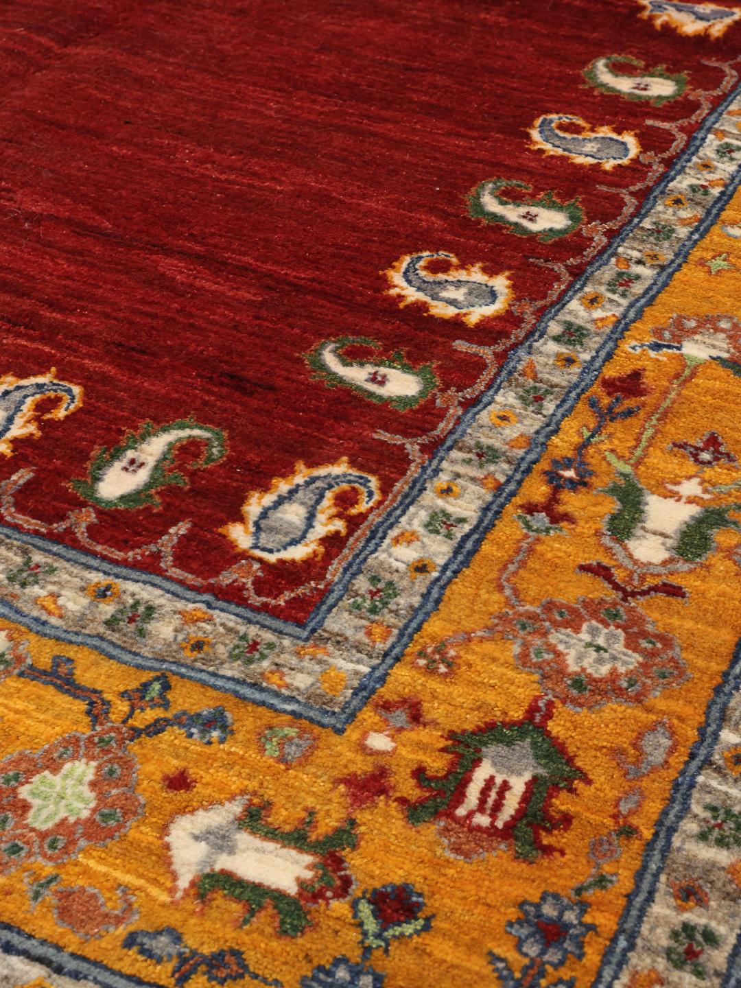 Handgeknoopt Loribaft-tapijt uit het Midden-Oosten met een rood veld en gouden rand