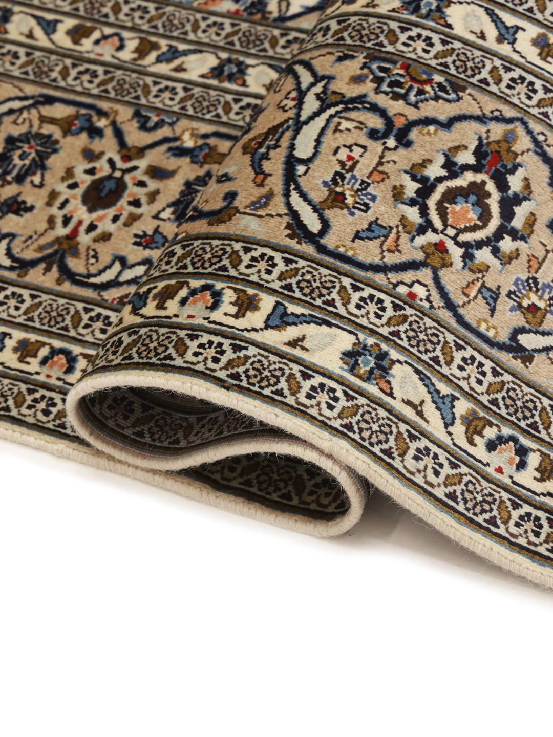 A hand-knotted Keshan rug from the Middle East with a beige background and floral patterns.