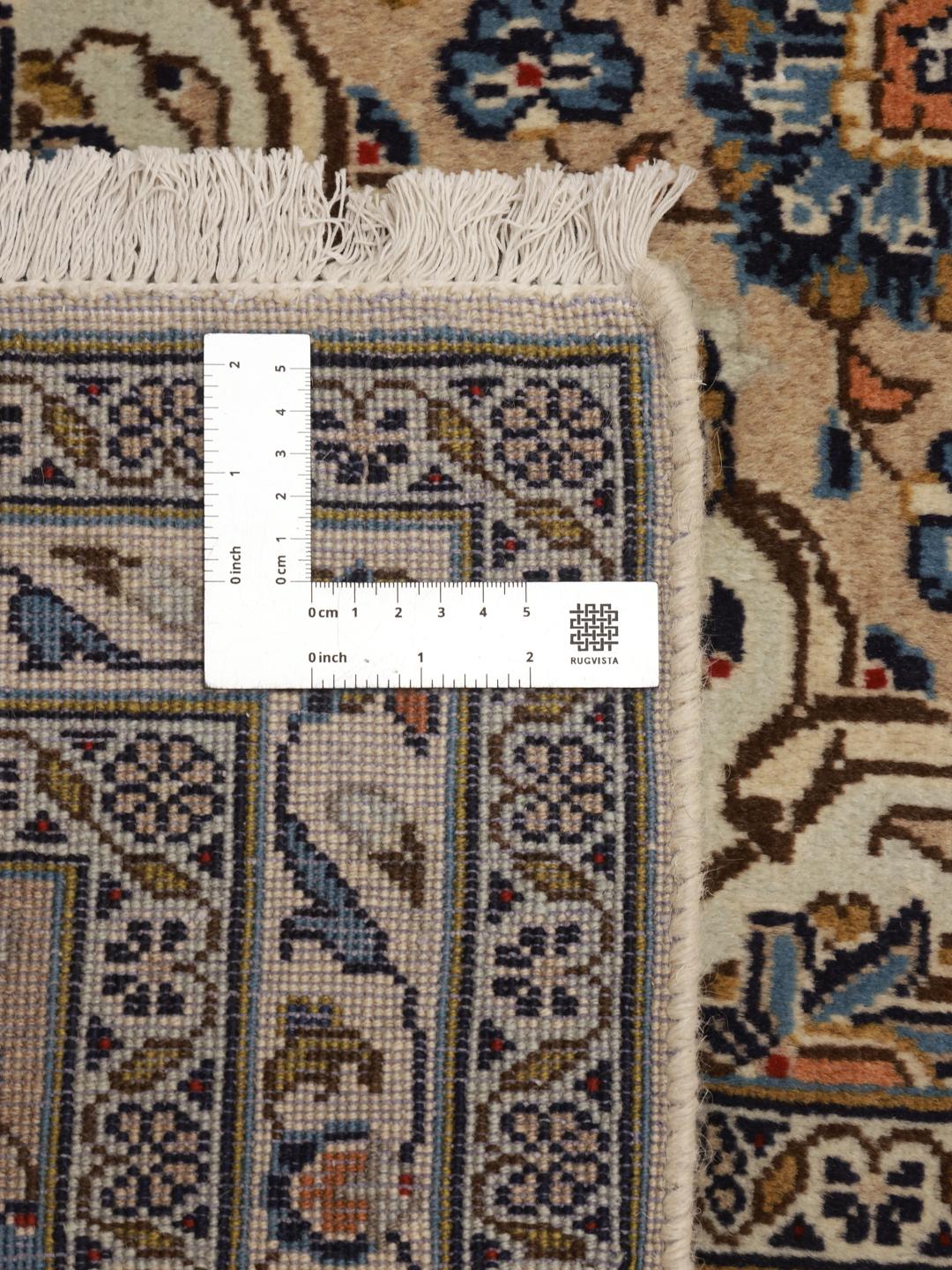 A hand-knotted Keshan rug from the Middle East with a beige background and floral patterns.