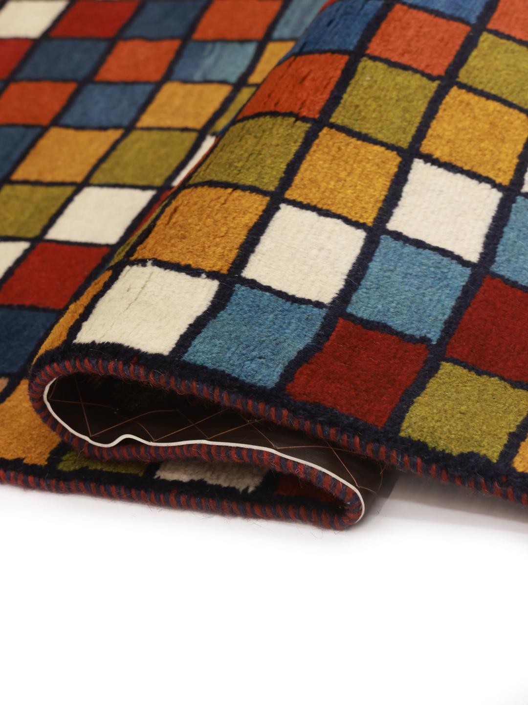 Hand-knotted Gabbeh rug from the Middle East featuring a vibrant multicolor grid pattern