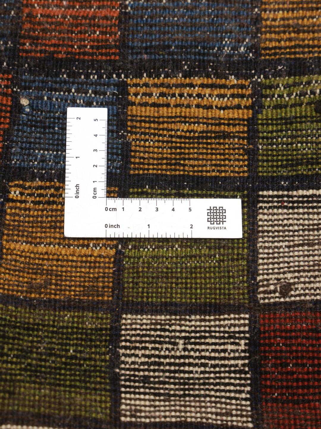 Hand-knotted Gabbeh rug from the Middle East featuring a vibrant multicolor grid pattern