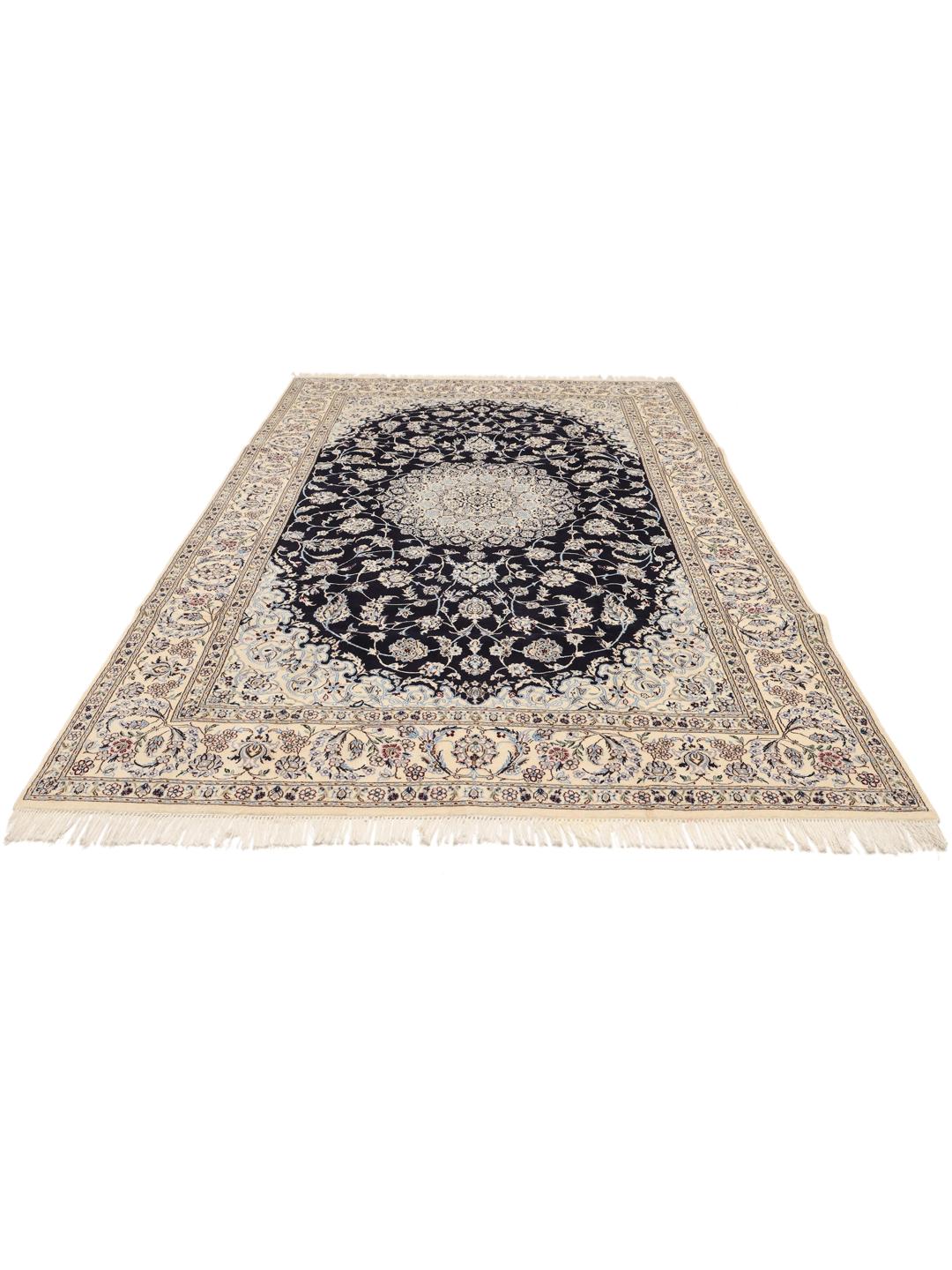 A hand-knotted Nain rug from the Middle East featuring a black field with light floral patterns.