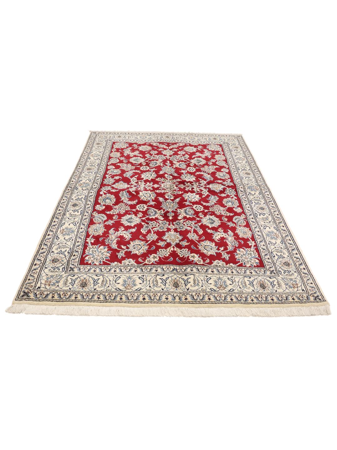 Hand-knotted Nain rug from the Middle East in deep red with floral patterns