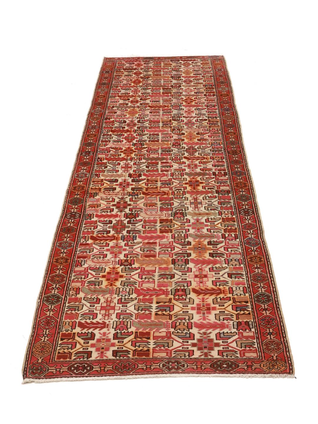 Handgeknoopte Ardebil-loper met geometrische motieven in veelkleurige wol uit het Midden-Oosten.