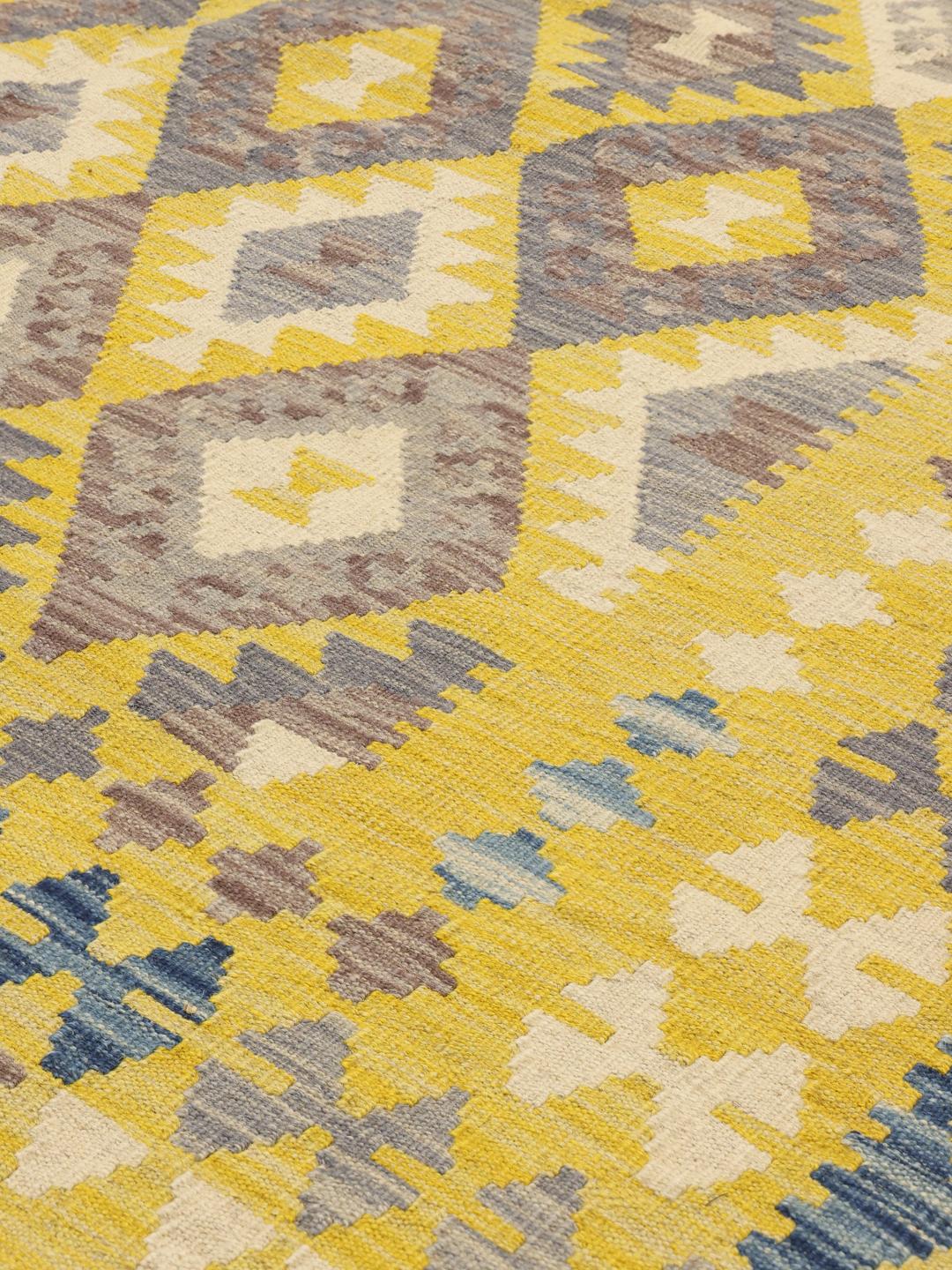 Hand-woven Afghan Kelim rug with vibrant yellow and grey geometric patterns