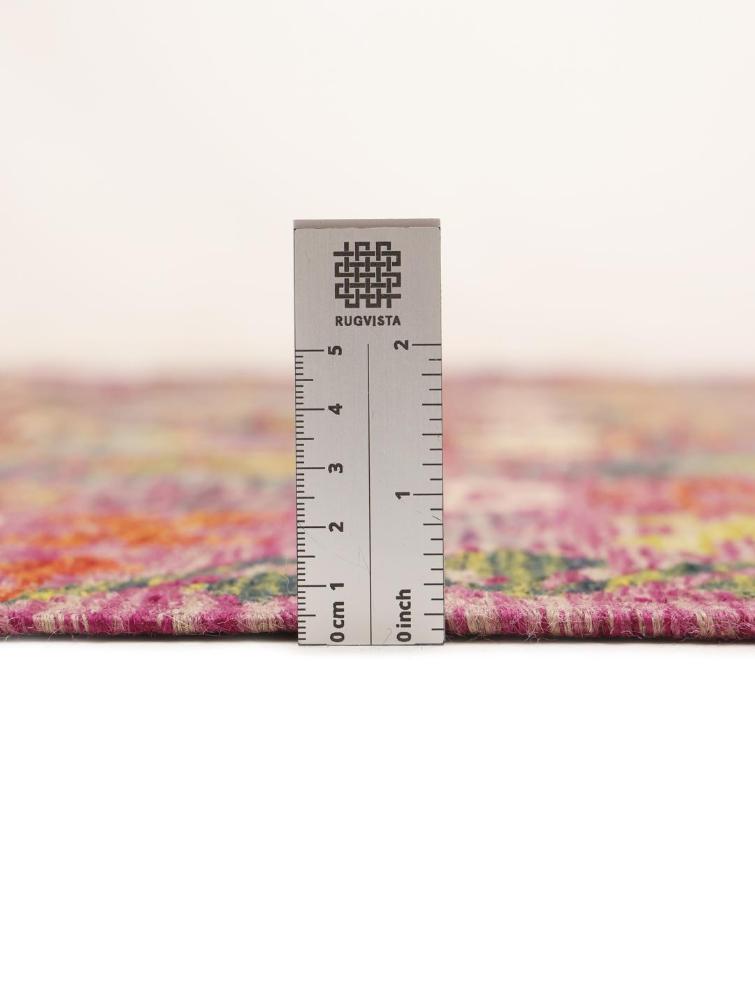 A hand-woven, one-of-a-kind Afghan kelim rug featuring a vibrant, multicoloured geometric pattern.
