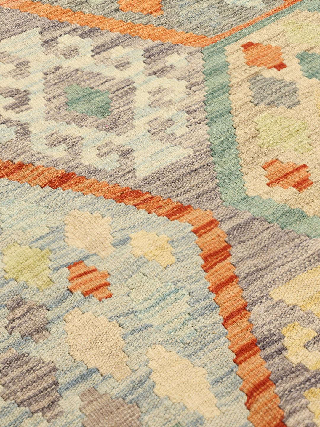 Hand-woven Afghan Kelim rug with geometric patterns in multicolour Wool.