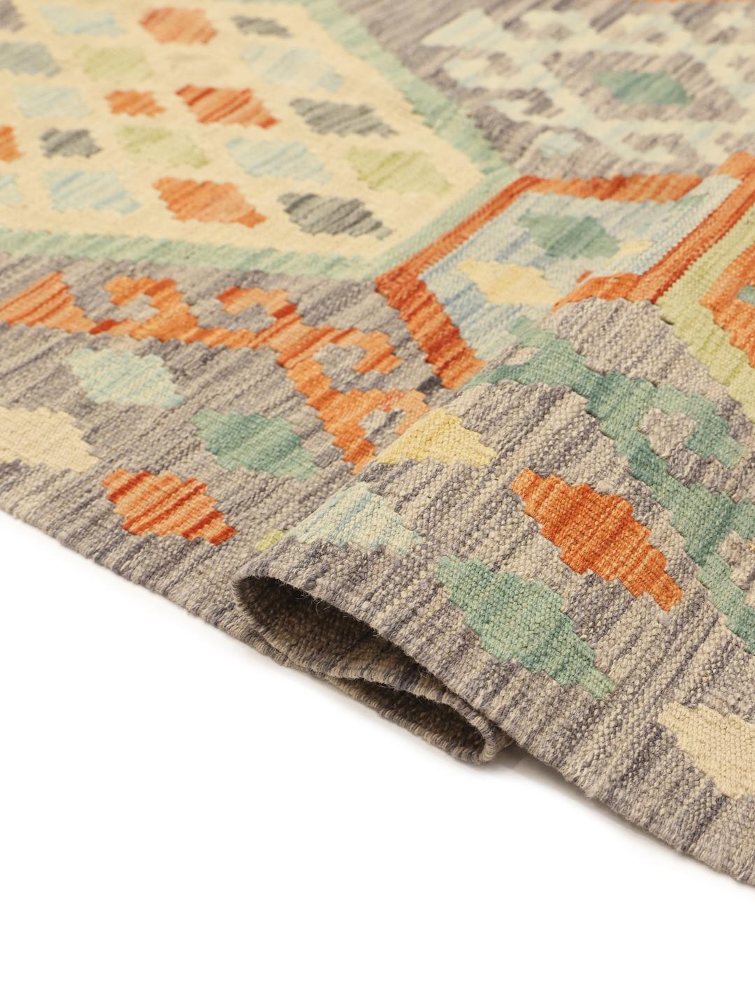 Hand-woven Afghan Kelim rug with geometric patterns in multicolour Wool.