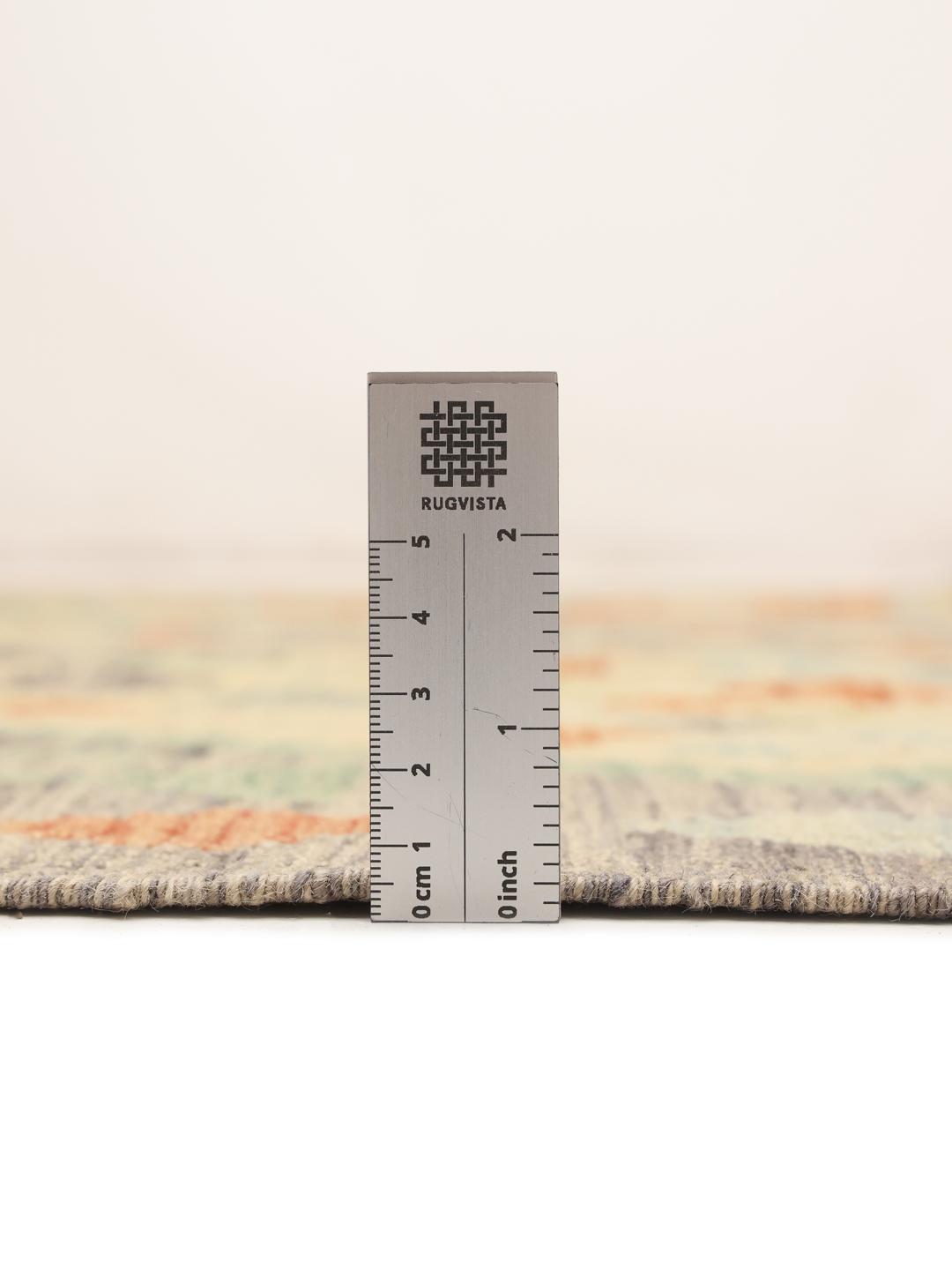 Hand-woven Afghan Kelim rug with geometric patterns in multicolour Wool.
