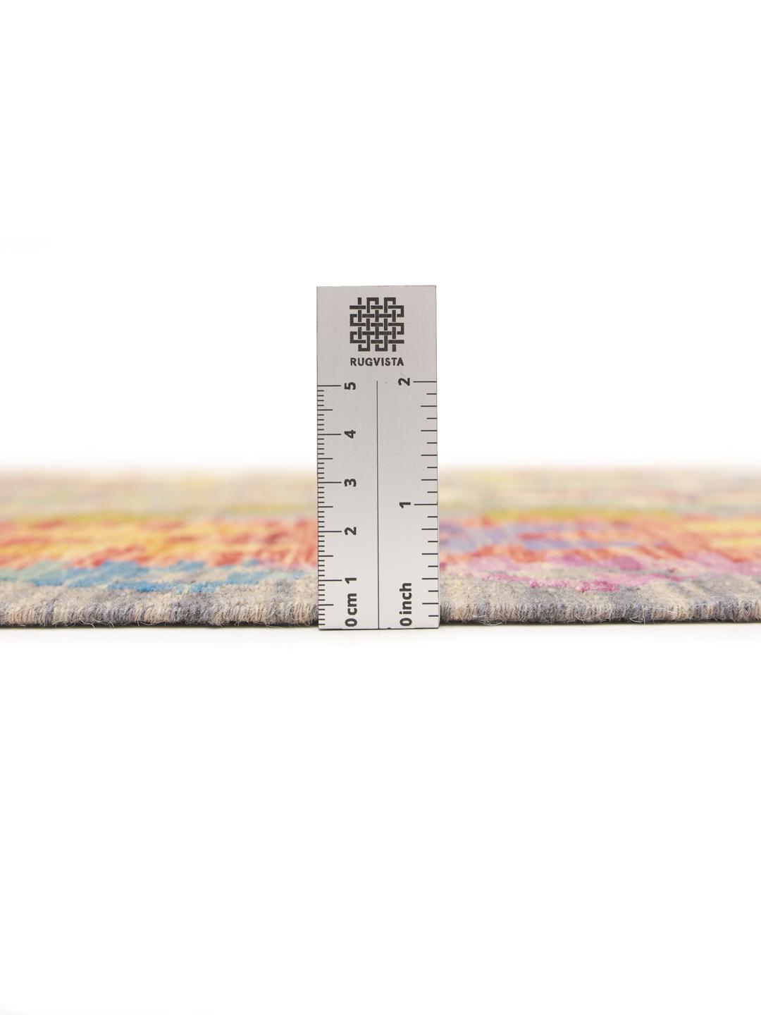 Hand-woven Afghan Kelim rug featuring a vibrant multicolor diamond pattern on a grey background