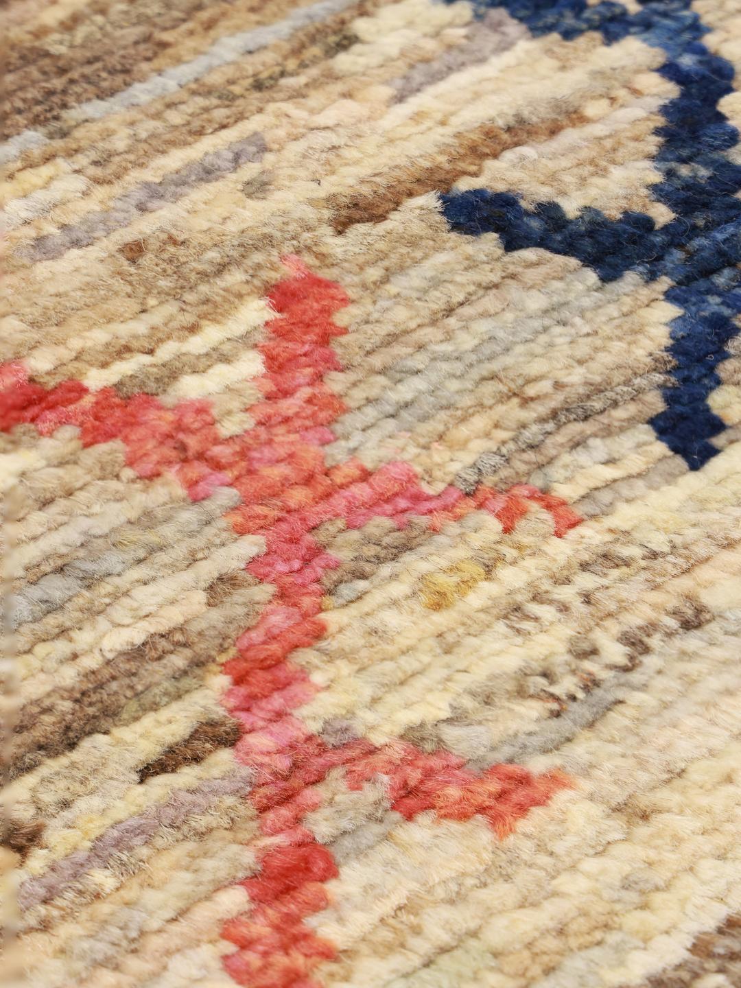 Hand-knotted Afghan rug with a beige field and colourful geometric motifs