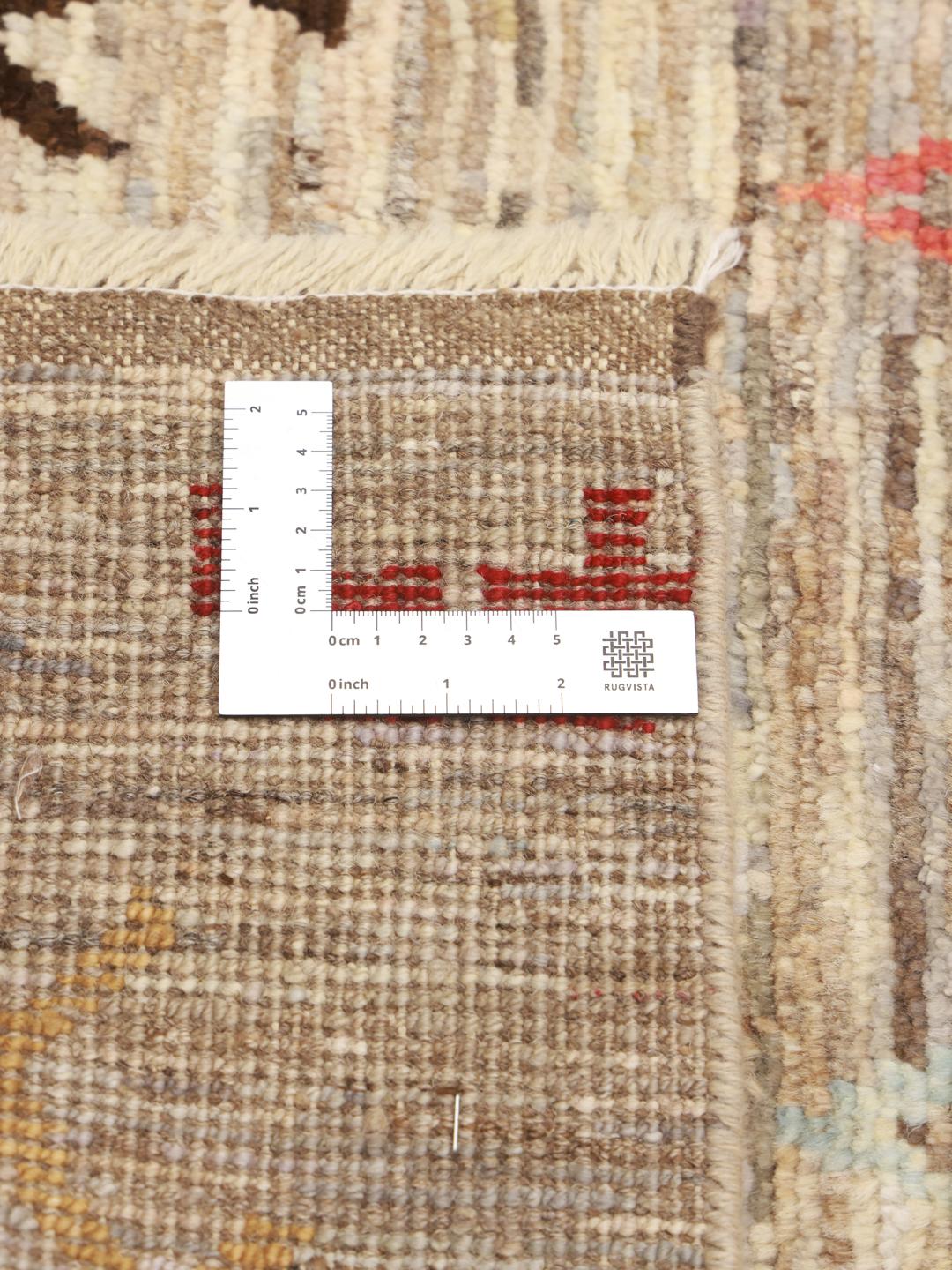 Hand-knotted Afghan rug with a beige field and colourful geometric motifs