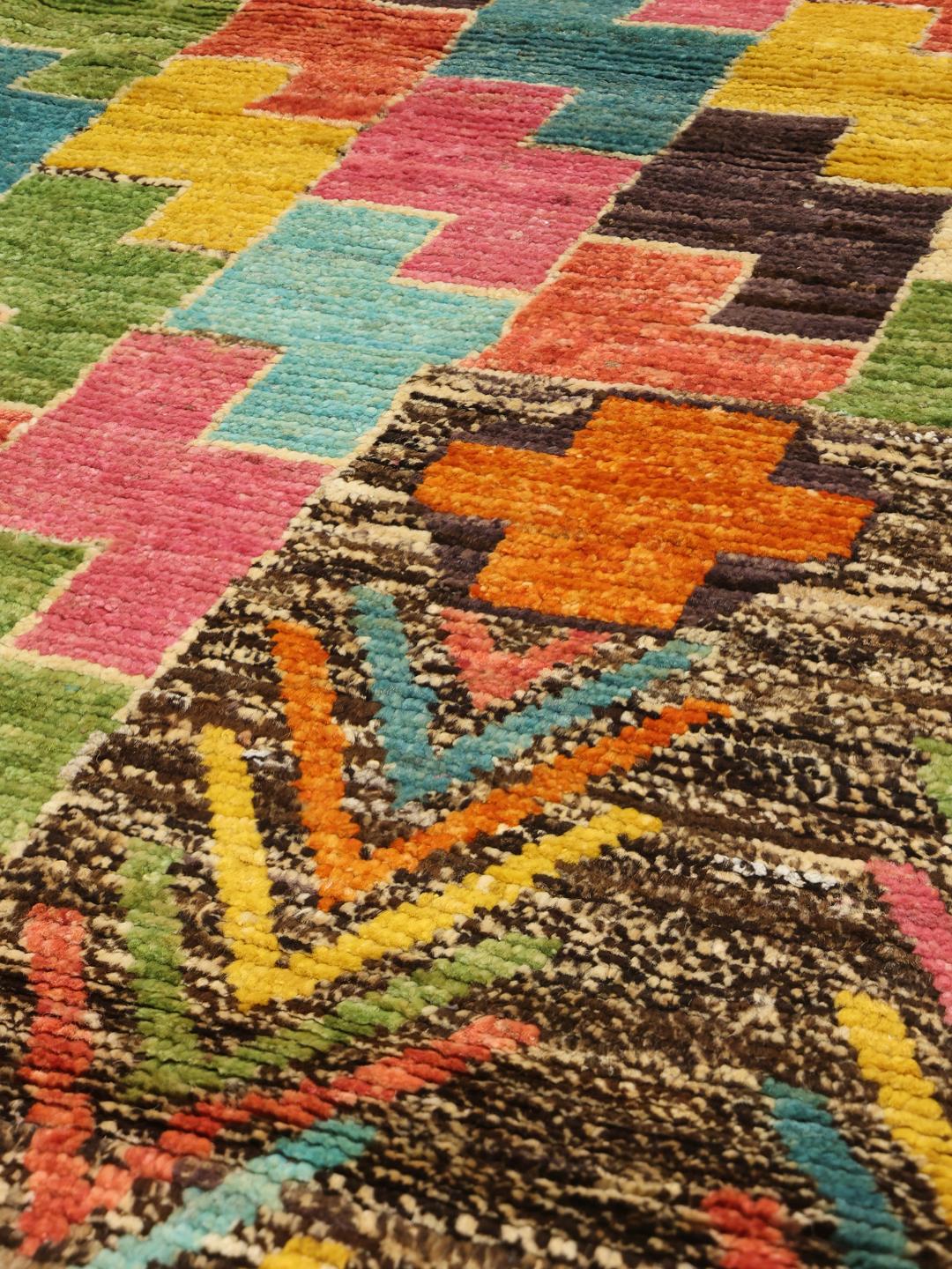 Hand-knotted Afghan rug with a multicolor geometric pattern