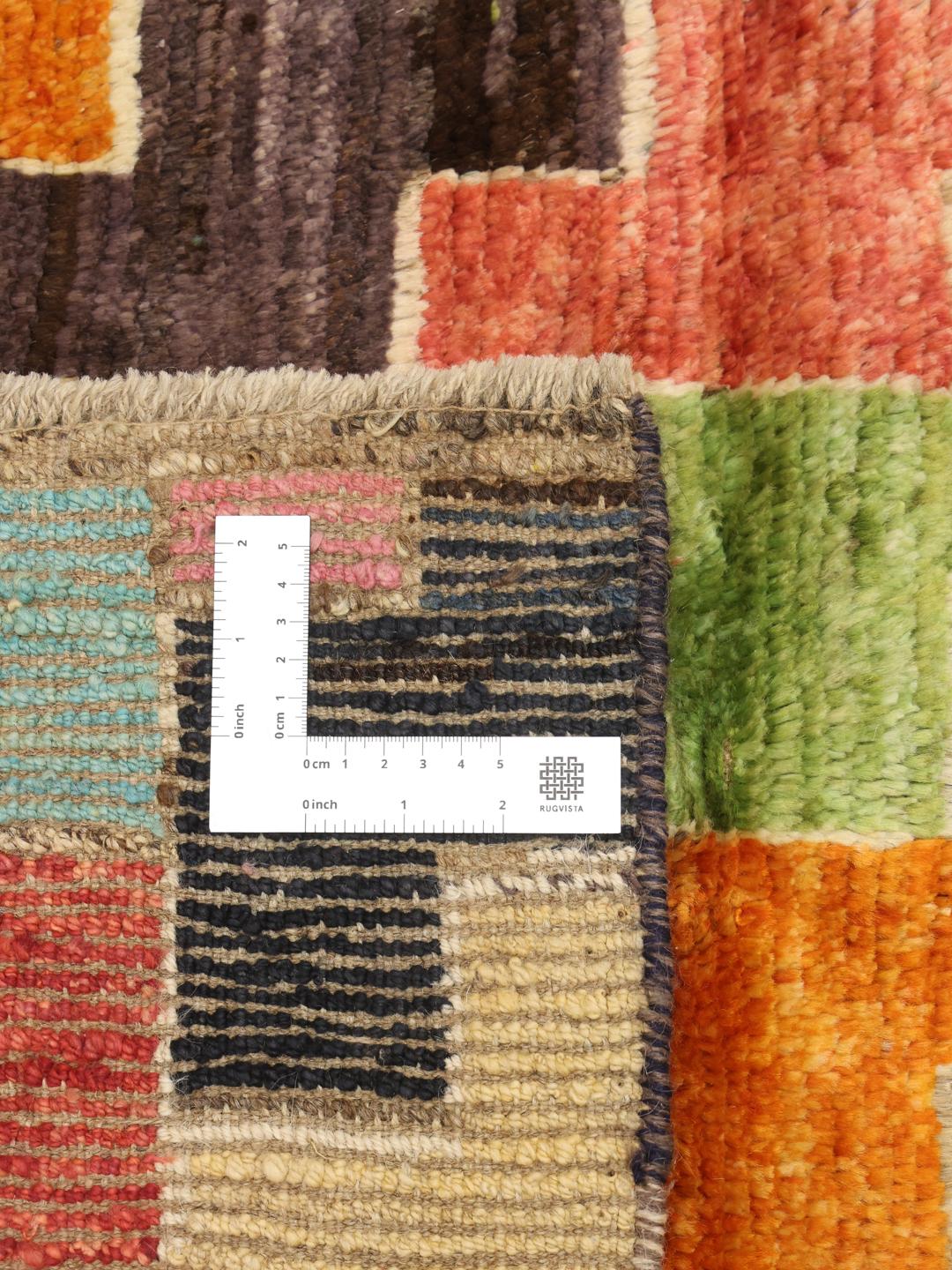Hand-knotted Afghan rug with a multicolor geometric pattern