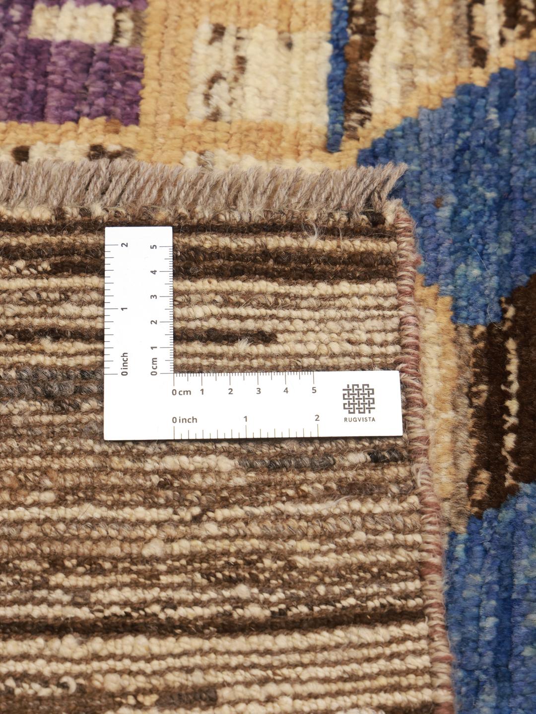 Hand-knotted Afghan rug with colourful artistic motifs on a brown background