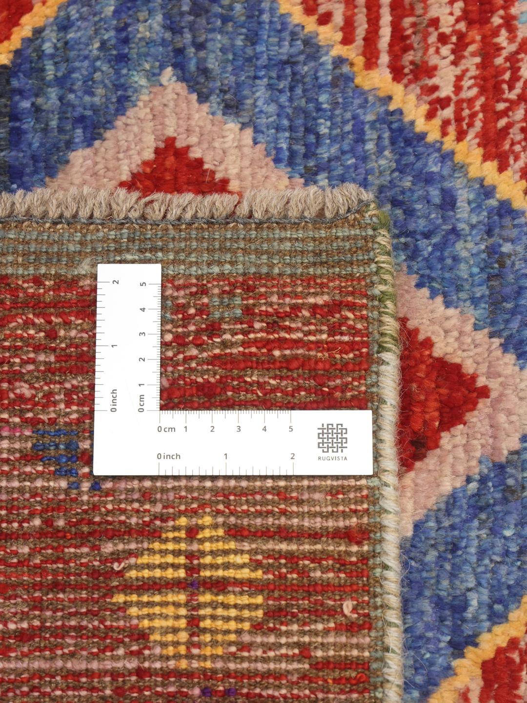 Håndknyttet afghansk tæppe med et levende flerfarvet geometrisk design