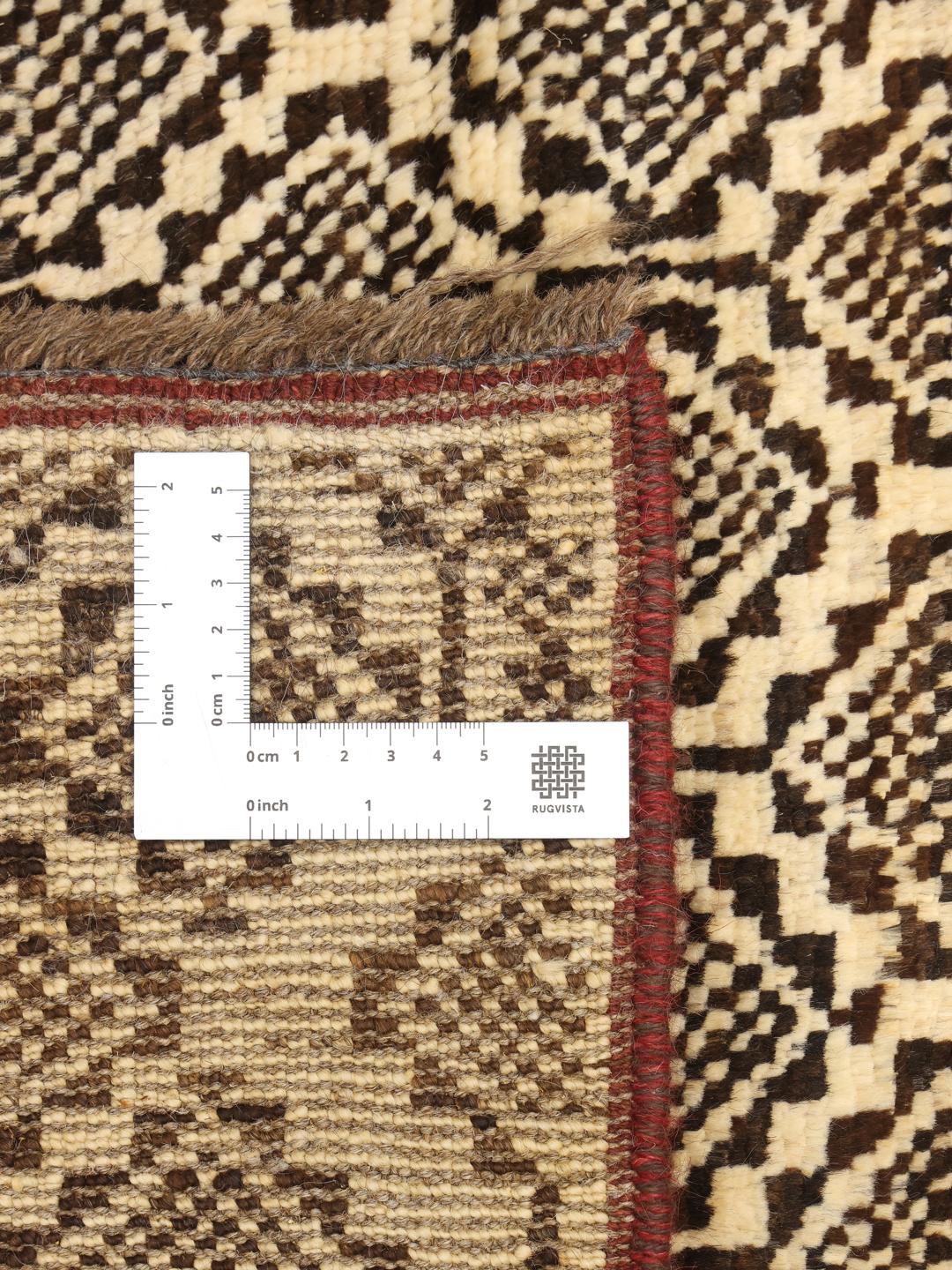 Hand-knotted Afghan runner with a geometric pattern in beige and black