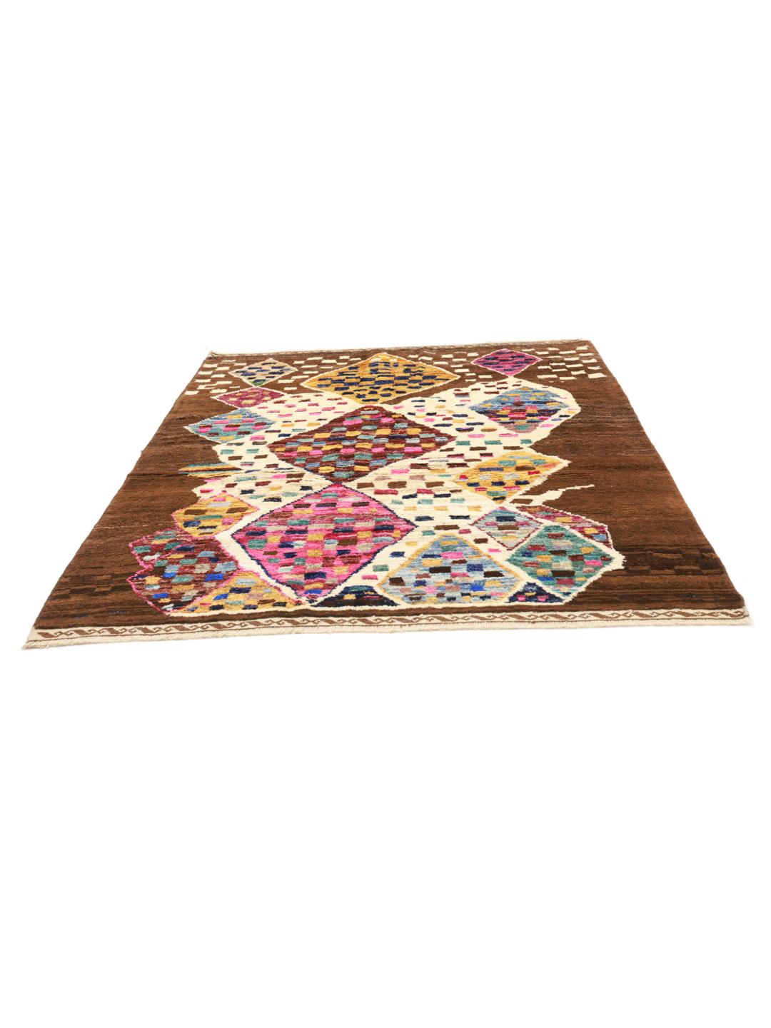 Hand-knotted Berber rug from Afghanistan with colourful diamond patterns on a brown background.