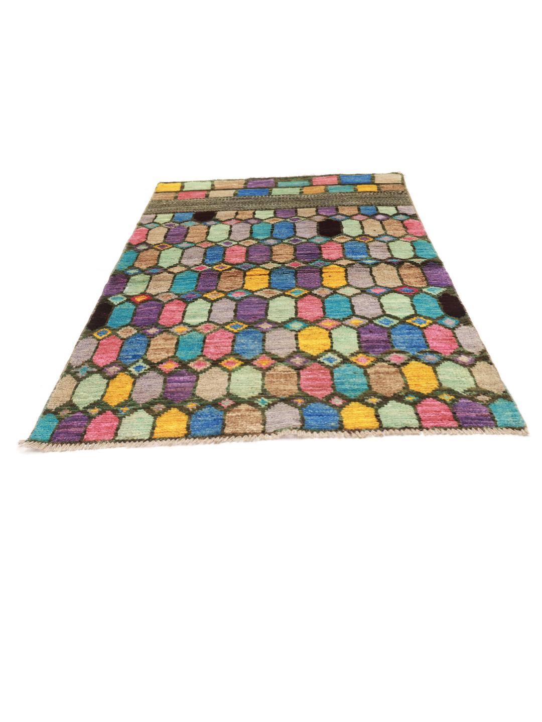 A vibrant rectangular Berber rug from Afghanistan with a colourful geometric pattern.