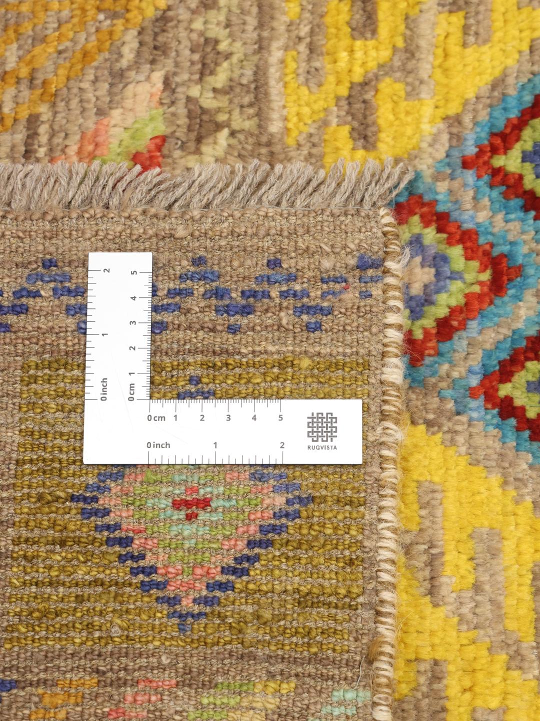 Handgeknoopt Afghaans kleed met levendige geometrische patronen in meerkleurige wol