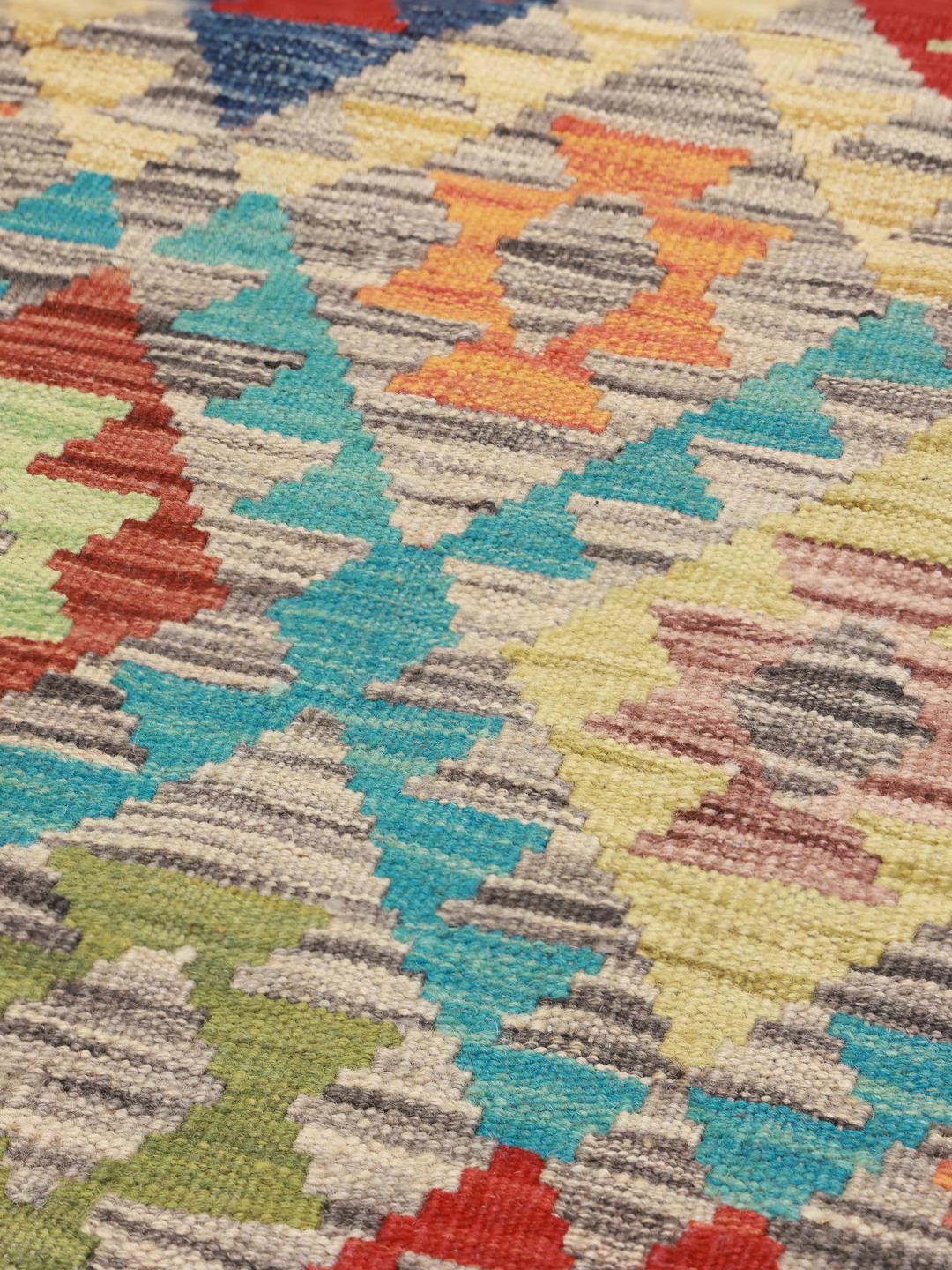 Hand-woven Afghan Kelim rug with a vibrant multicolor geometric pattern