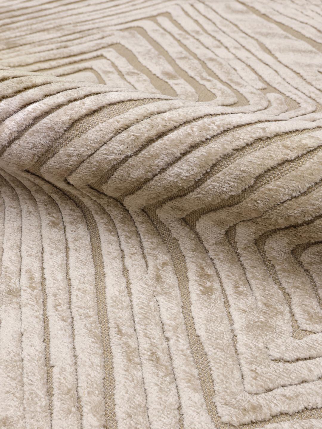 Beige vloerkleed met een getextureerd ruitpatroon
