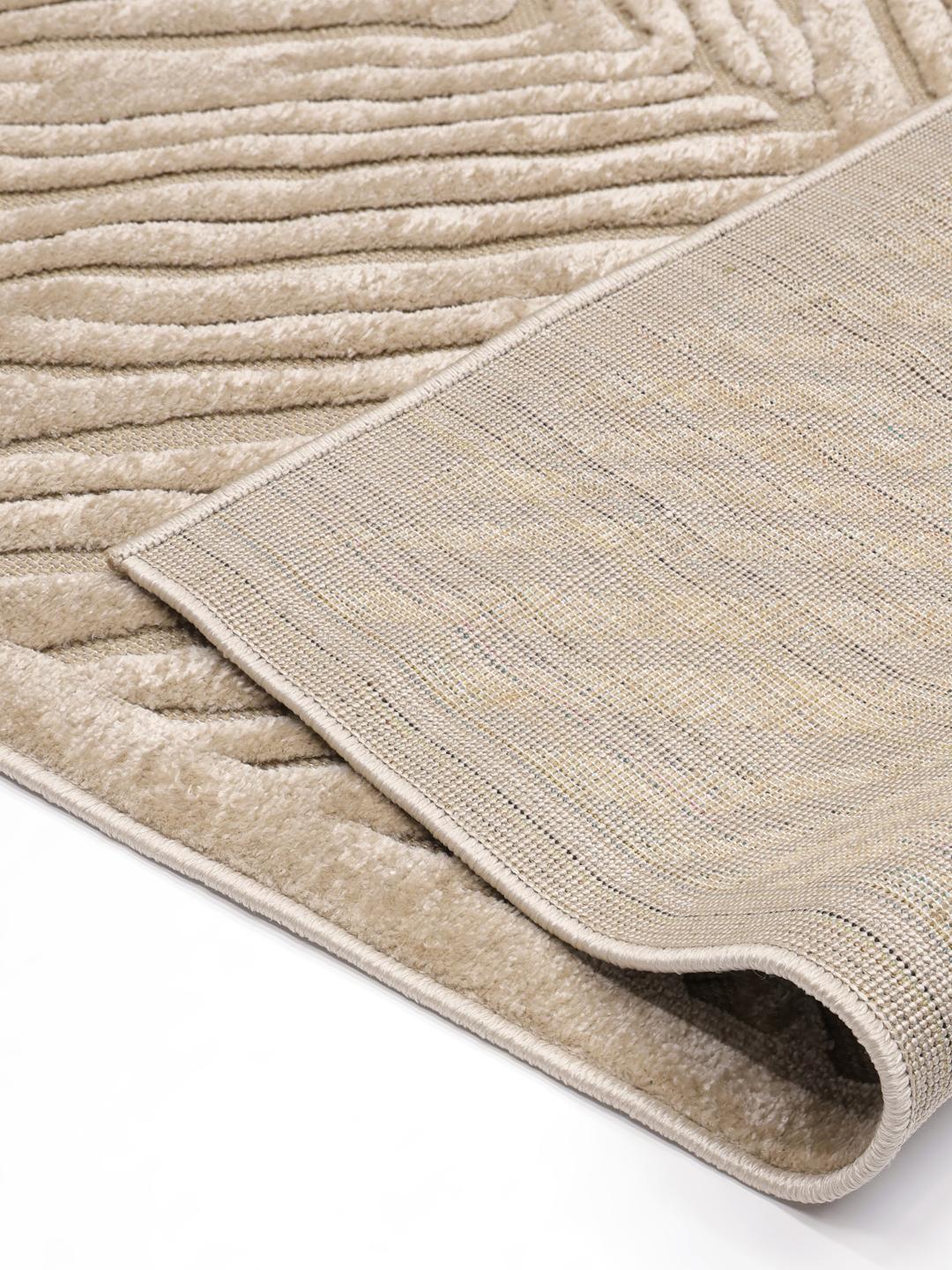 Beige tæppe med et tekstureret diamantmønster