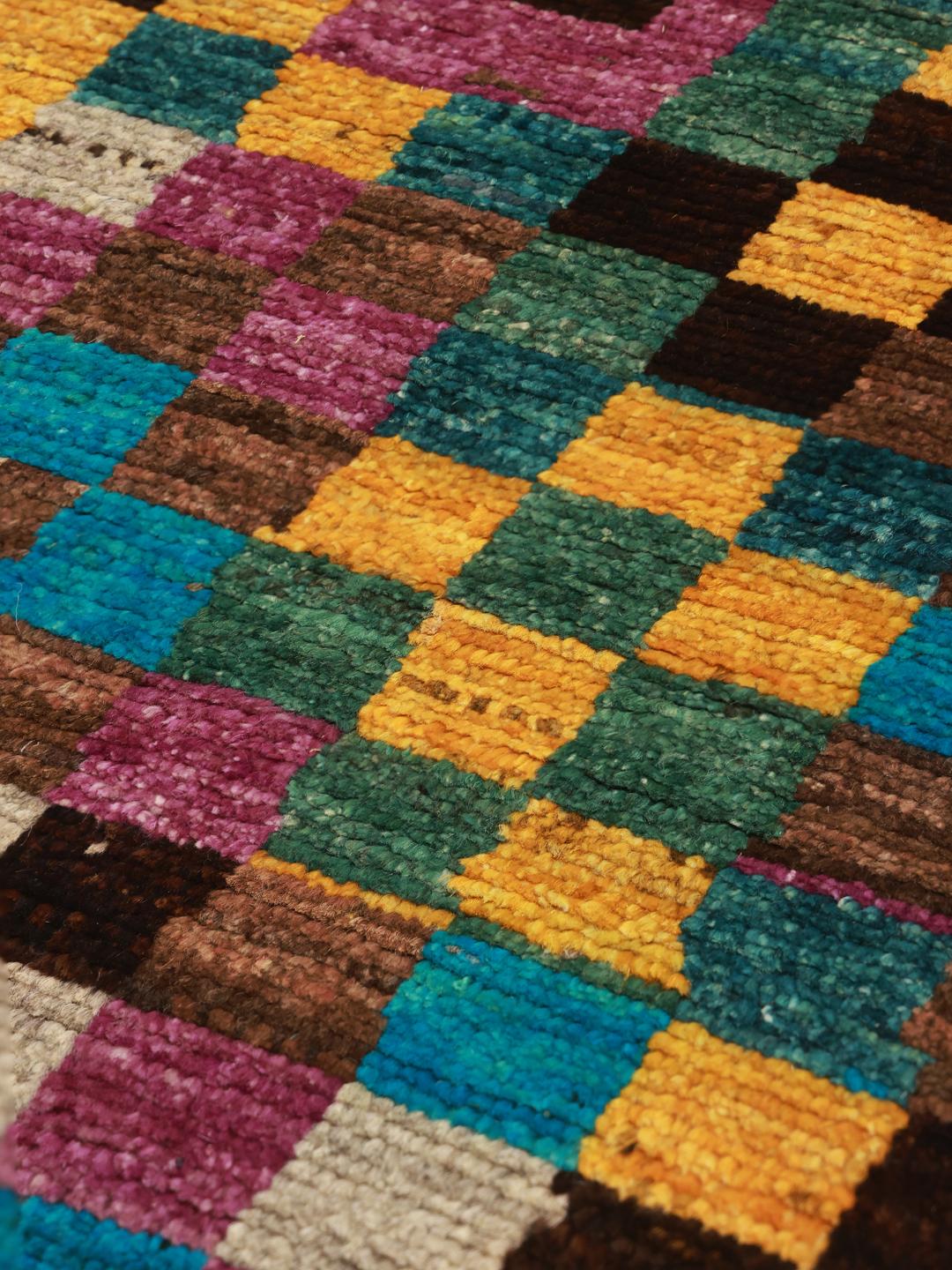 Hand-knotted Middle Eastern runner with a vibrant, multicoloured checkered pattern.