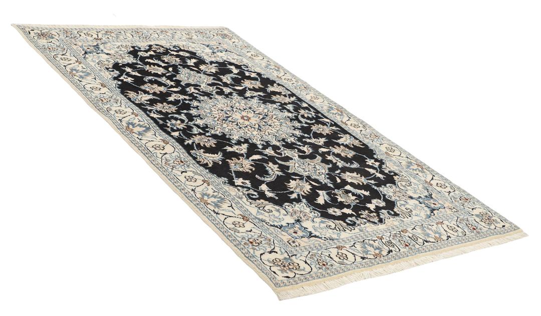 Hand-knotted Nain rug from the Middle East in black and blue