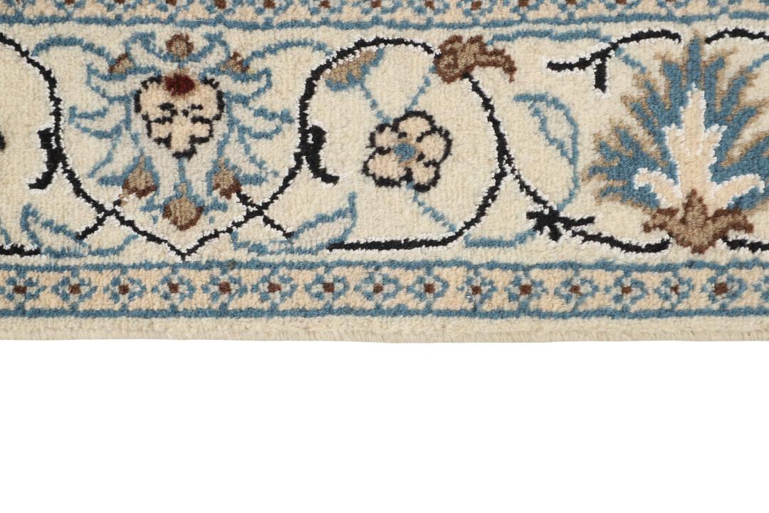 Hand-knotted Nain rug from the Middle East in black and blue