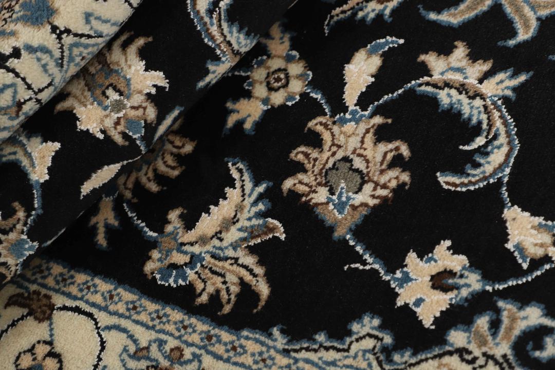 Hand-knotted Nain rug from the Middle East in black and blue