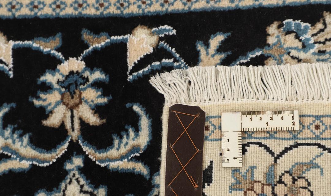 Hand-knotted Nain rug from the Middle East in black and blue