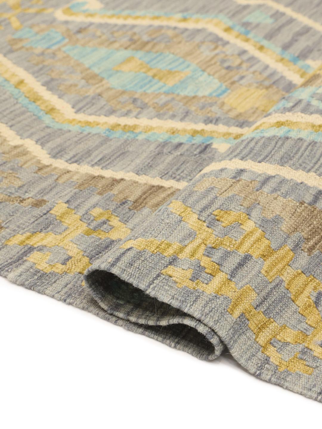 Hand-woven Afghan Kelim rug featuring geometric motifs in shades of blue and brown