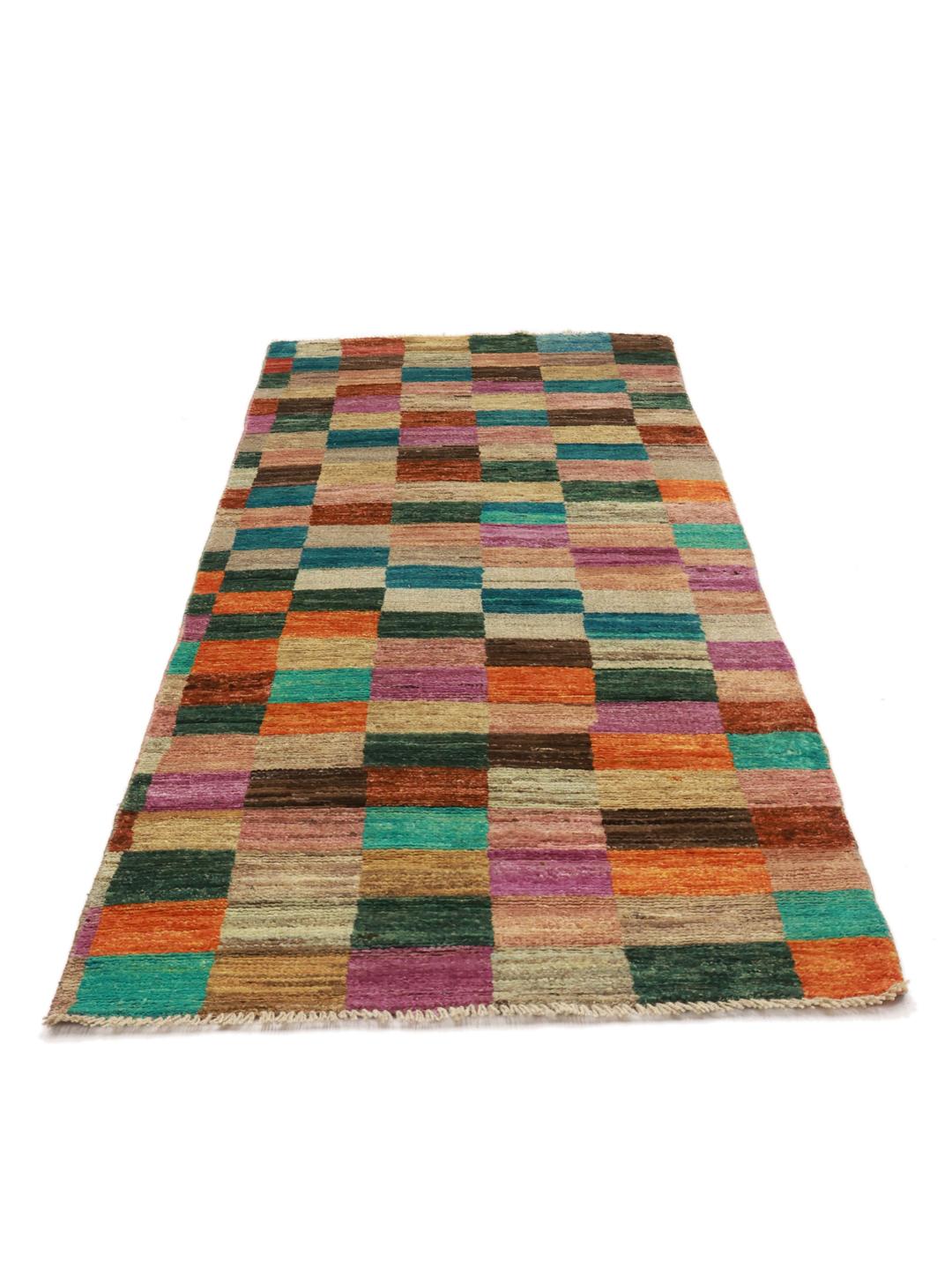 A vibrant multicoloured hand-knotted runner from Afghanistan with a geometric block pattern.