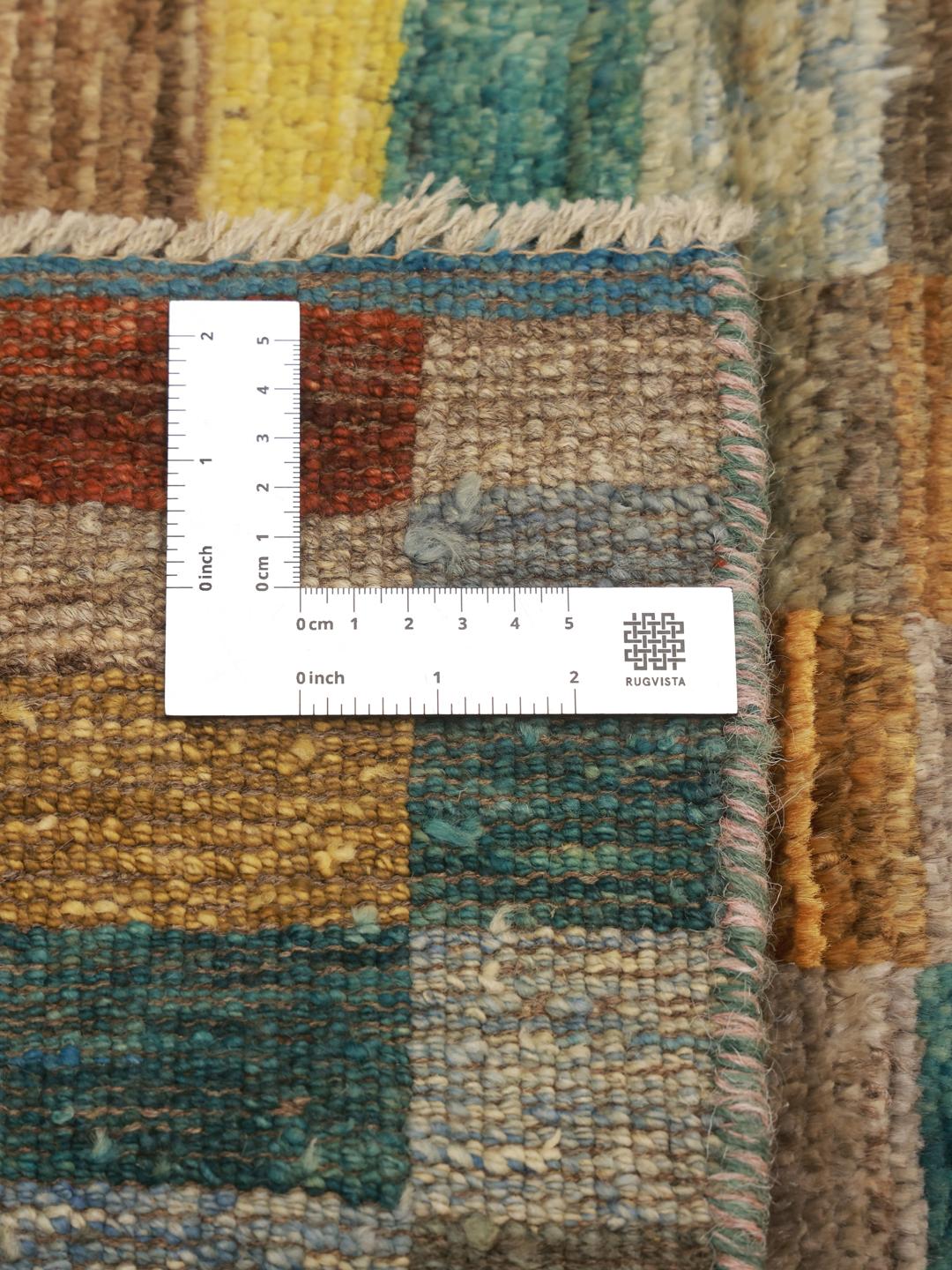 A vibrant multicoloured hand-knotted runner from Afghanistan with a geometric block pattern.