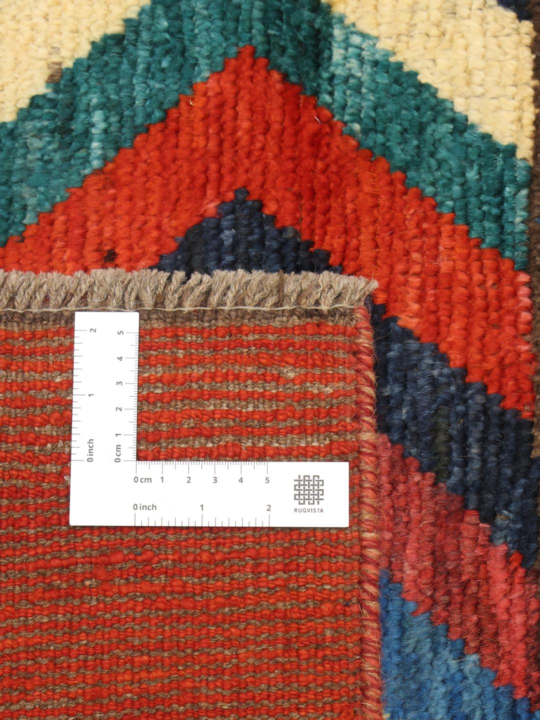 Handgeknoopt Berber-tapijt uit Afghanistan met levendige geometrische patronen in veelkleurige wol