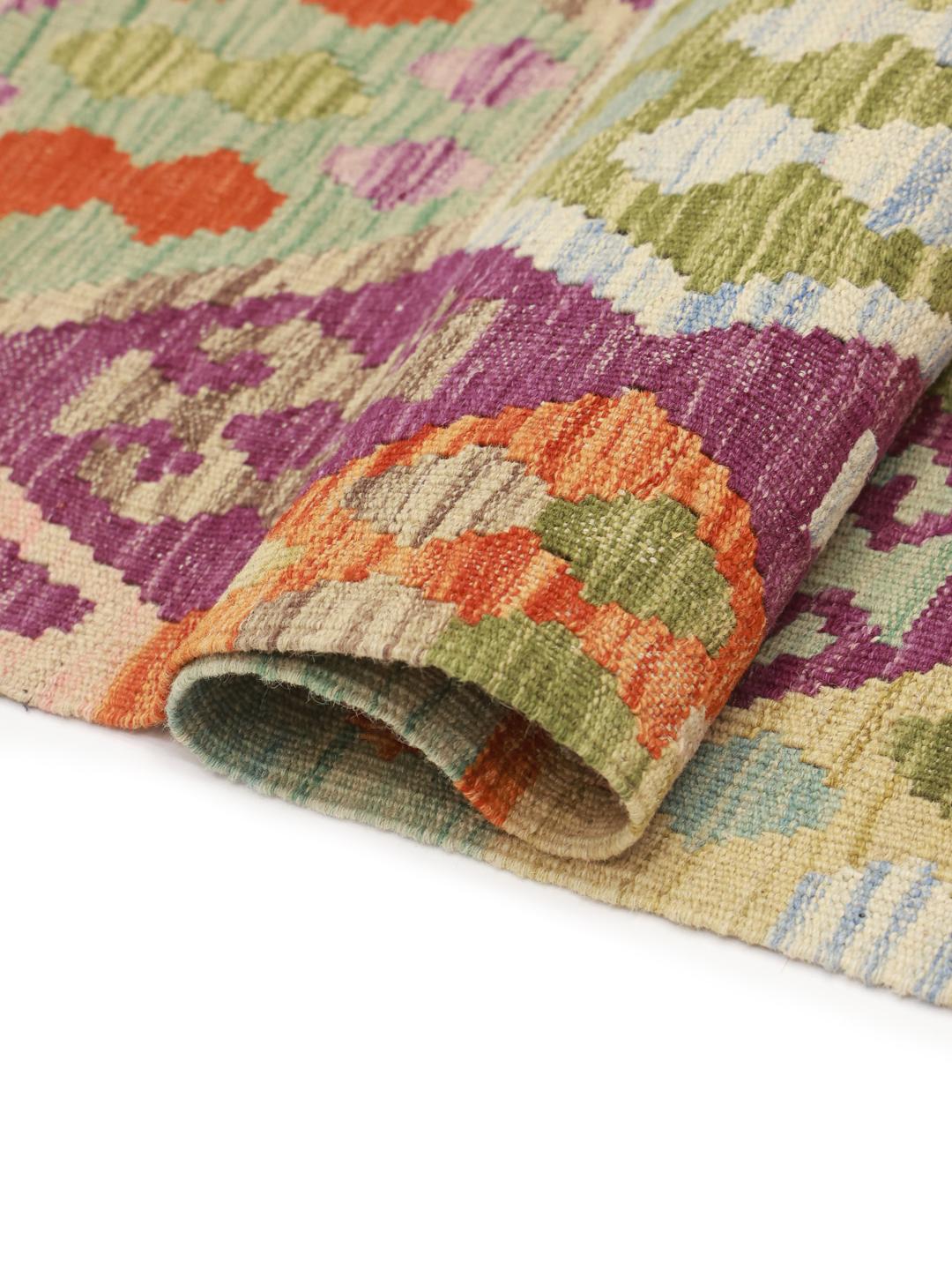 Hand-woven Afghan Kelim rug featuring a vibrant multicolor geometric pattern